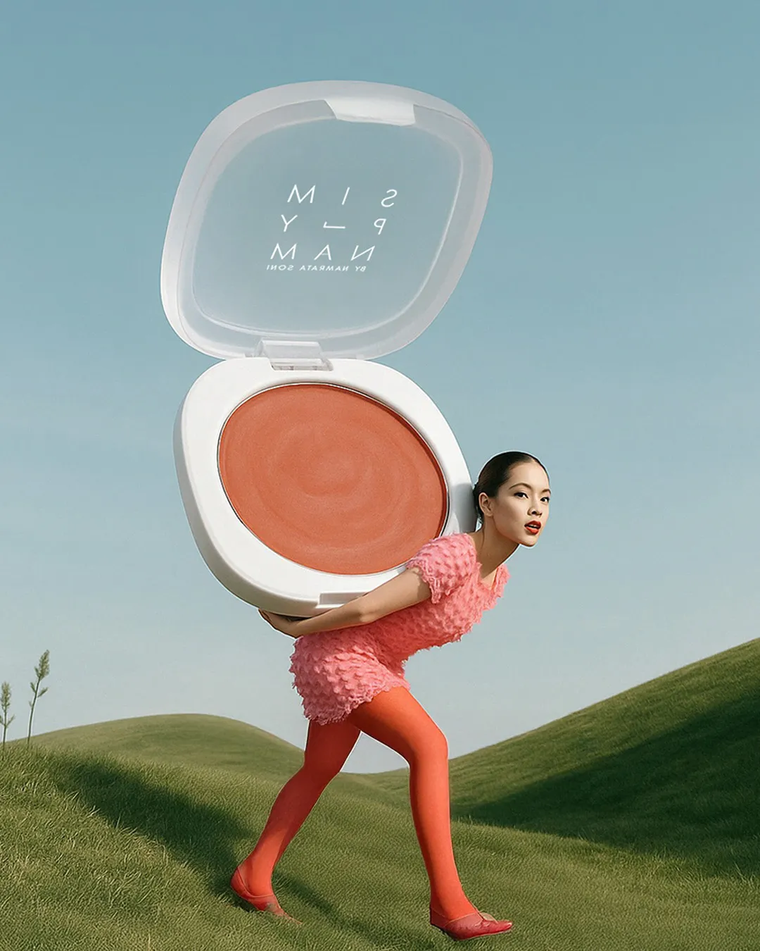 An image of a woman carrying Simply Nam cream blush from Simply Nam