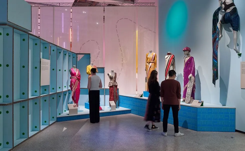 Exhibition view of The Offbeat Sari at the Design Museum London, showcasing contemporary and traditional sari interpretations in global fashion