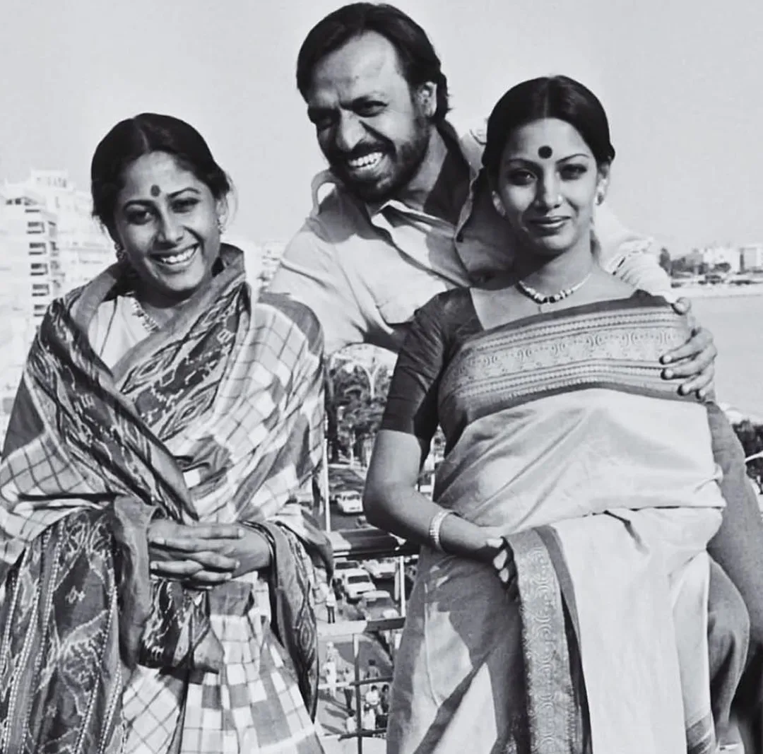 Smita Patil and Shabana Azmi in silk saris with Shyam Benegal, showcasing an early moment of Indian red carpet fashion at Cannes