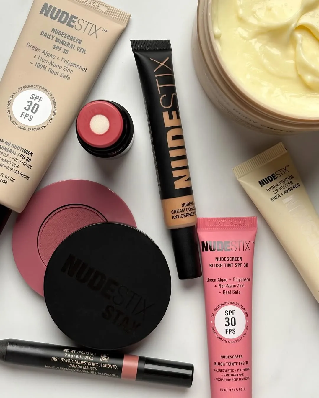 Lip balm with SPF and tinted moisturiser with SPF from Nudestix that offer sun protection