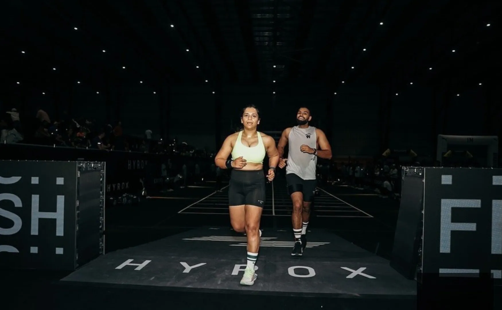 unners cross the finish line at Hyrox India, showcasing the community-driven fitness event format.