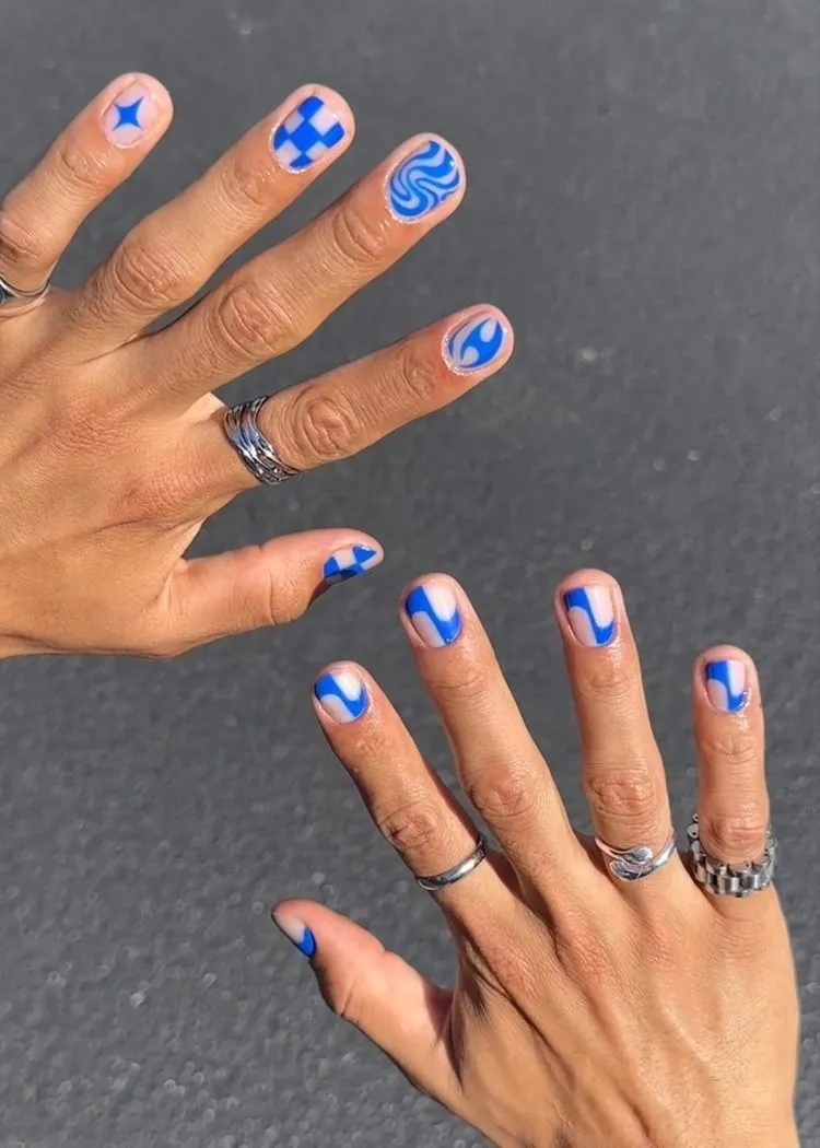 Blue and white nail art representing queer masculinity in India and how the country is redefining masculinity
