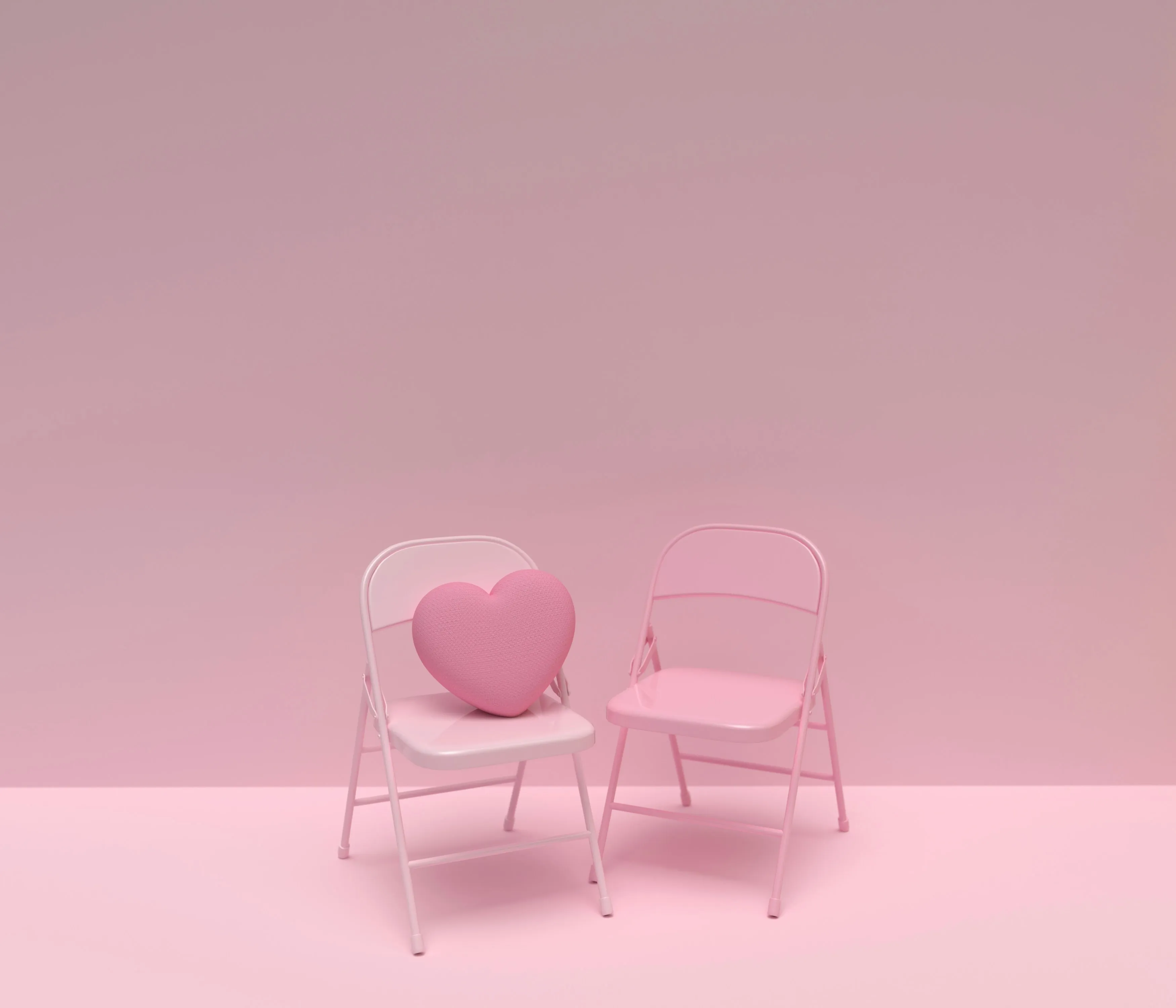 Two pink chairs with a pink heart on top of one to depict queer dating in India, and being single and queer in India, leading to why it’s hard to find queer love in India