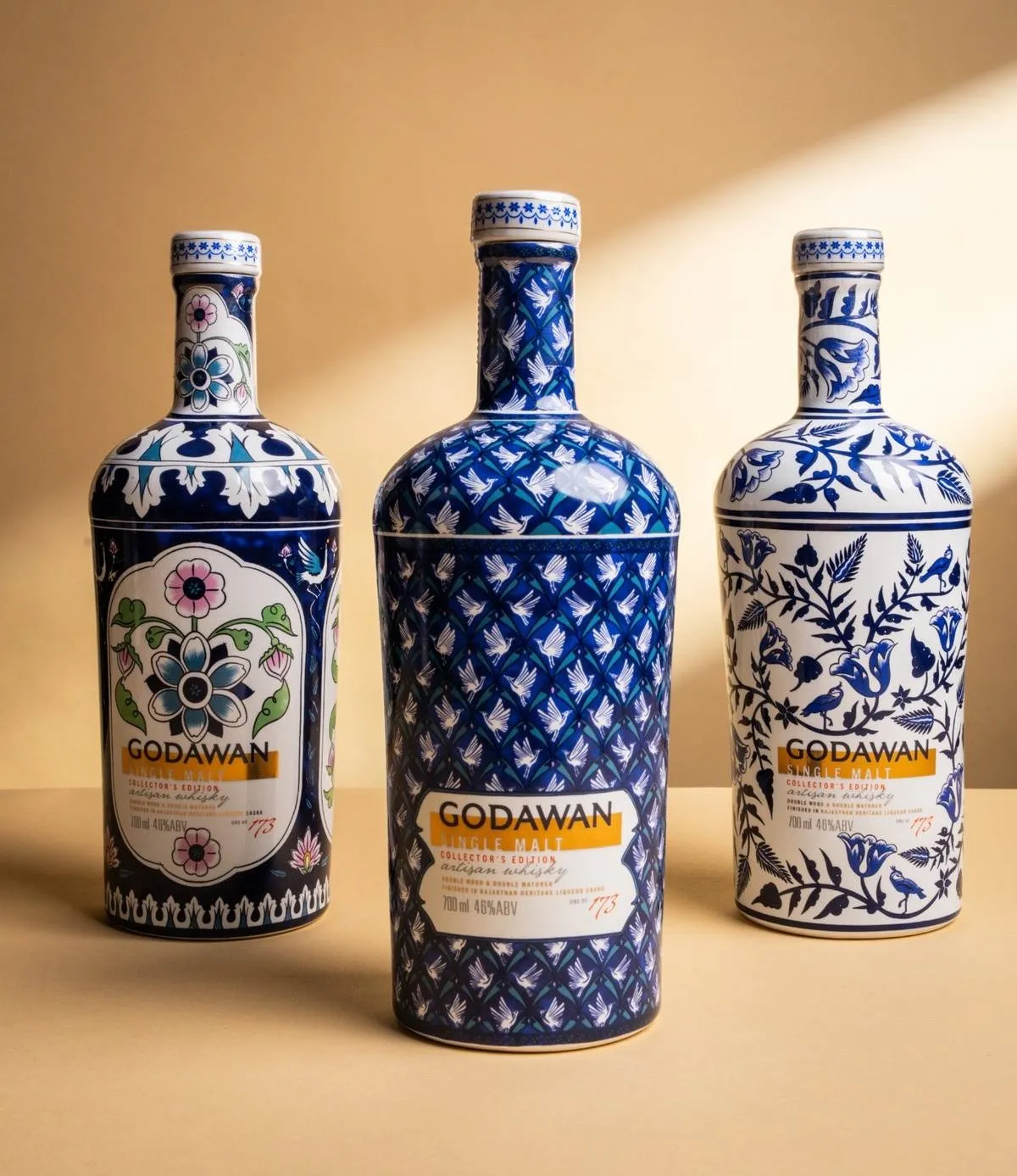 A picture of blue and white bottles of single malt whisky, the Godawan 173 to depict how people are drinking Indian single malt, especially since the single malt whisky price in India is now affordable for people here