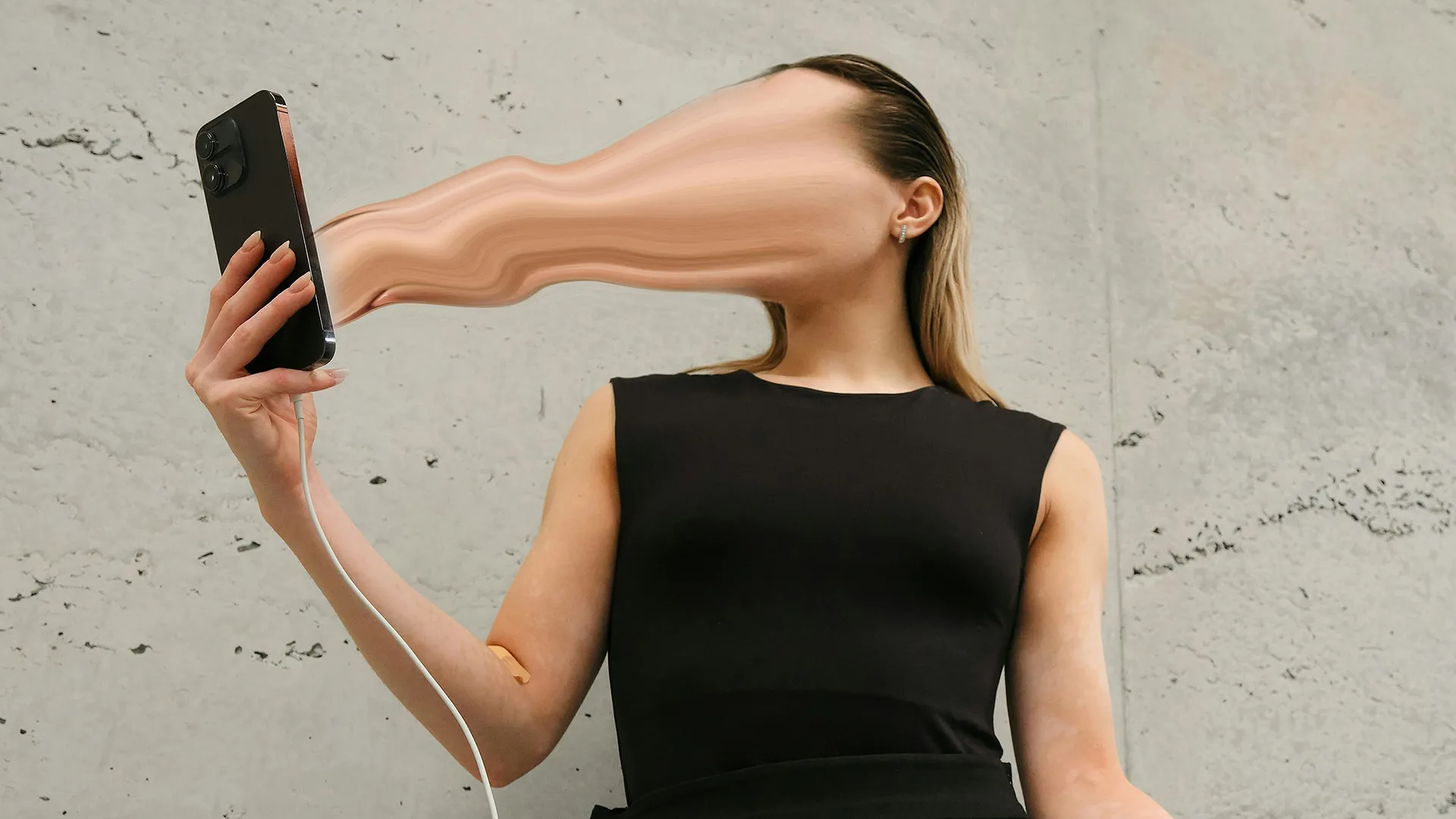 A picture of a woman holding a phone with her face going into the screen to depict how online outrage culture feeds off attention marketing and rage baiting in marketing