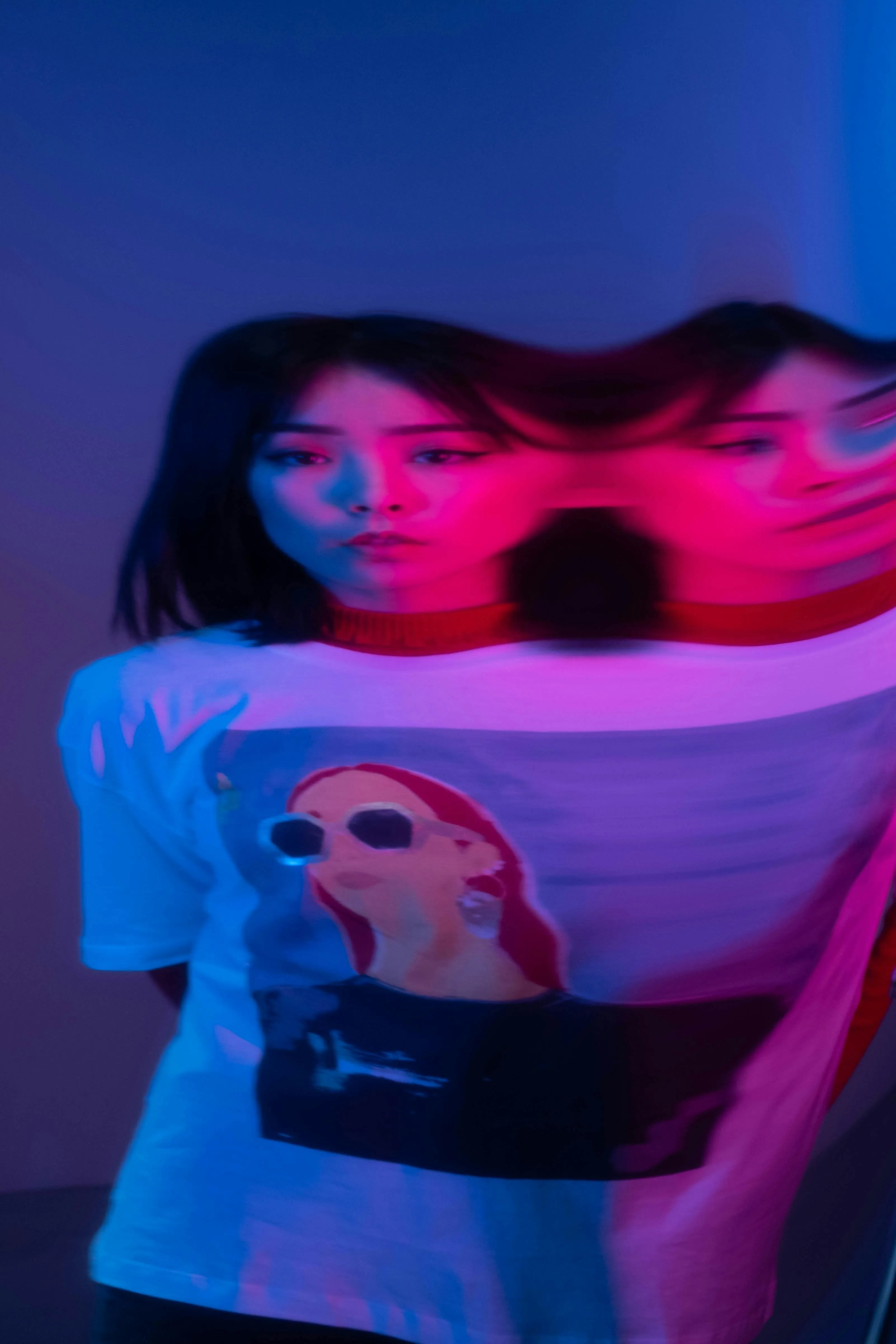 A woman wearing a t-shirt with Asian art to depict Asian influence in India, Japanese minimalism in India and East Asian beauty in India