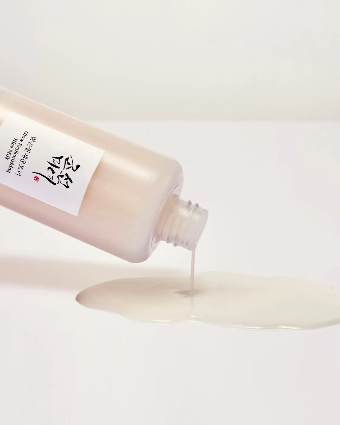 Milky toner flowing out of the beauty of joseon bottle