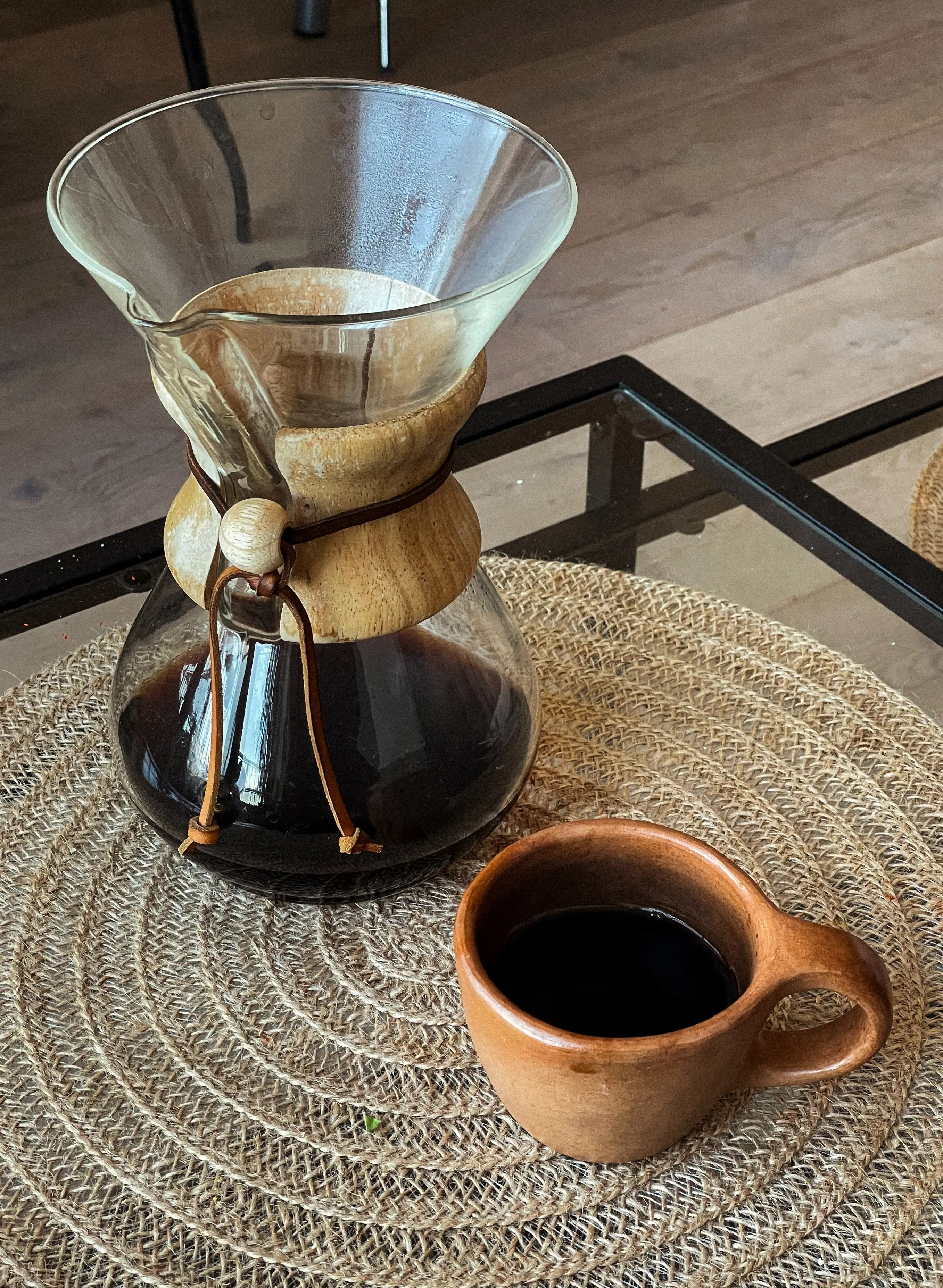 A picture of a pour over coffee maker and a cup of coffee to show how home brewing coffee India is rising with the introduction of pour-over coffee India.