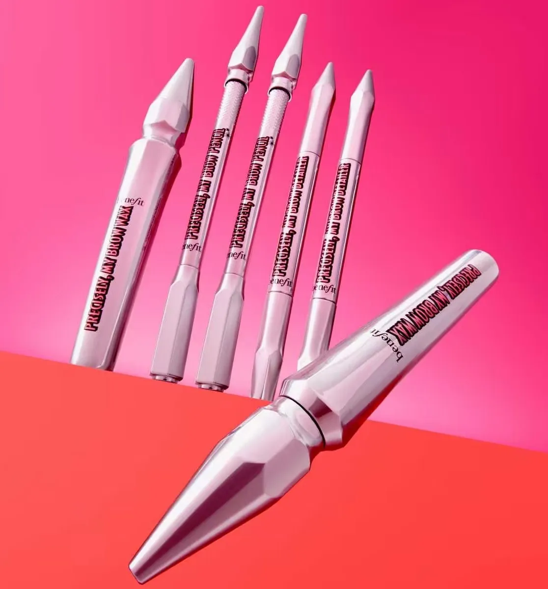 A few eyebrow grooming kit essentials from benefit cosmetics against a white and pink backdrop
