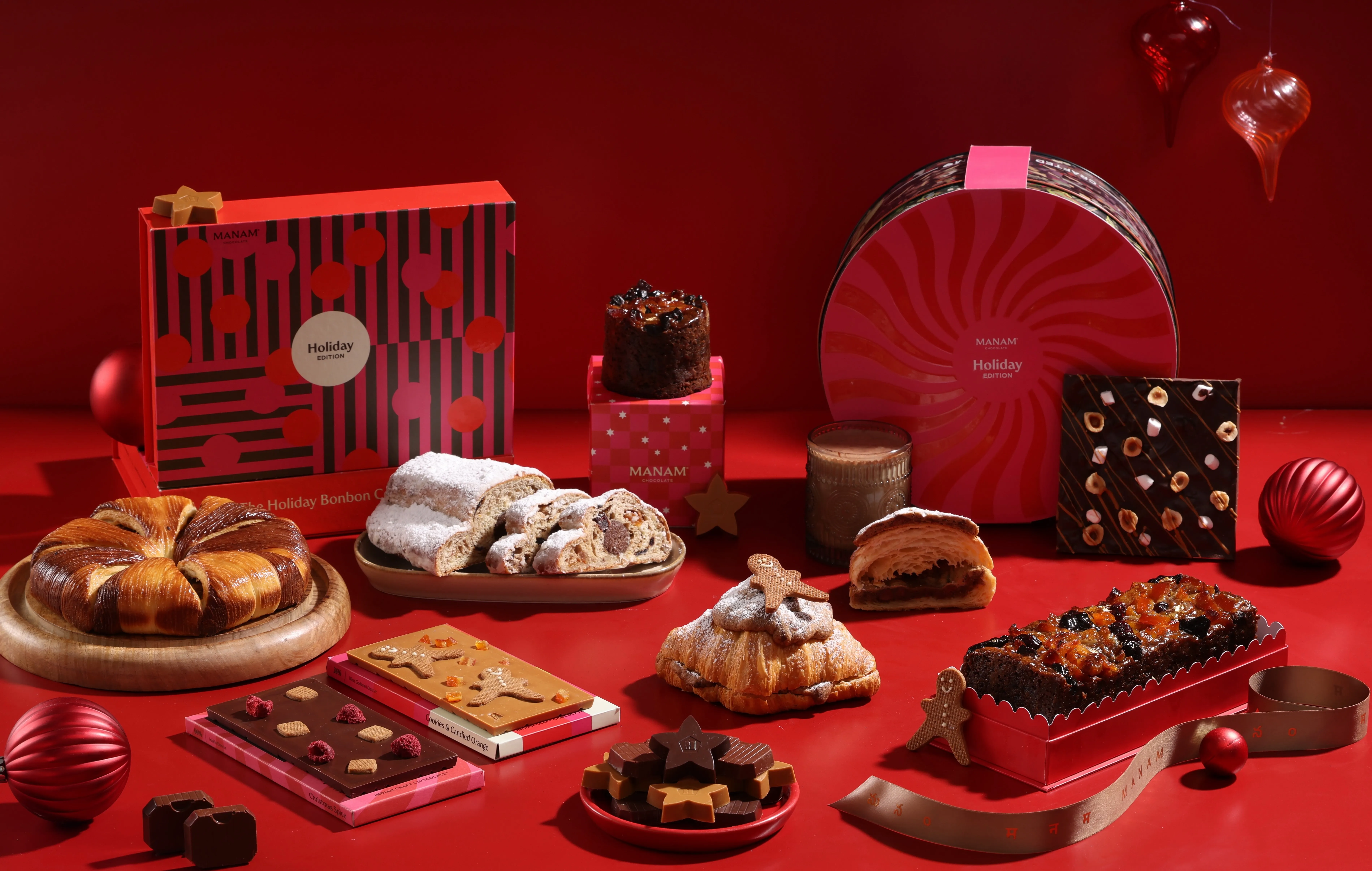An array of baked Christmas food gifts India as well as chocolates at Manam Chocolate, including one of the best Christmas Cake in India