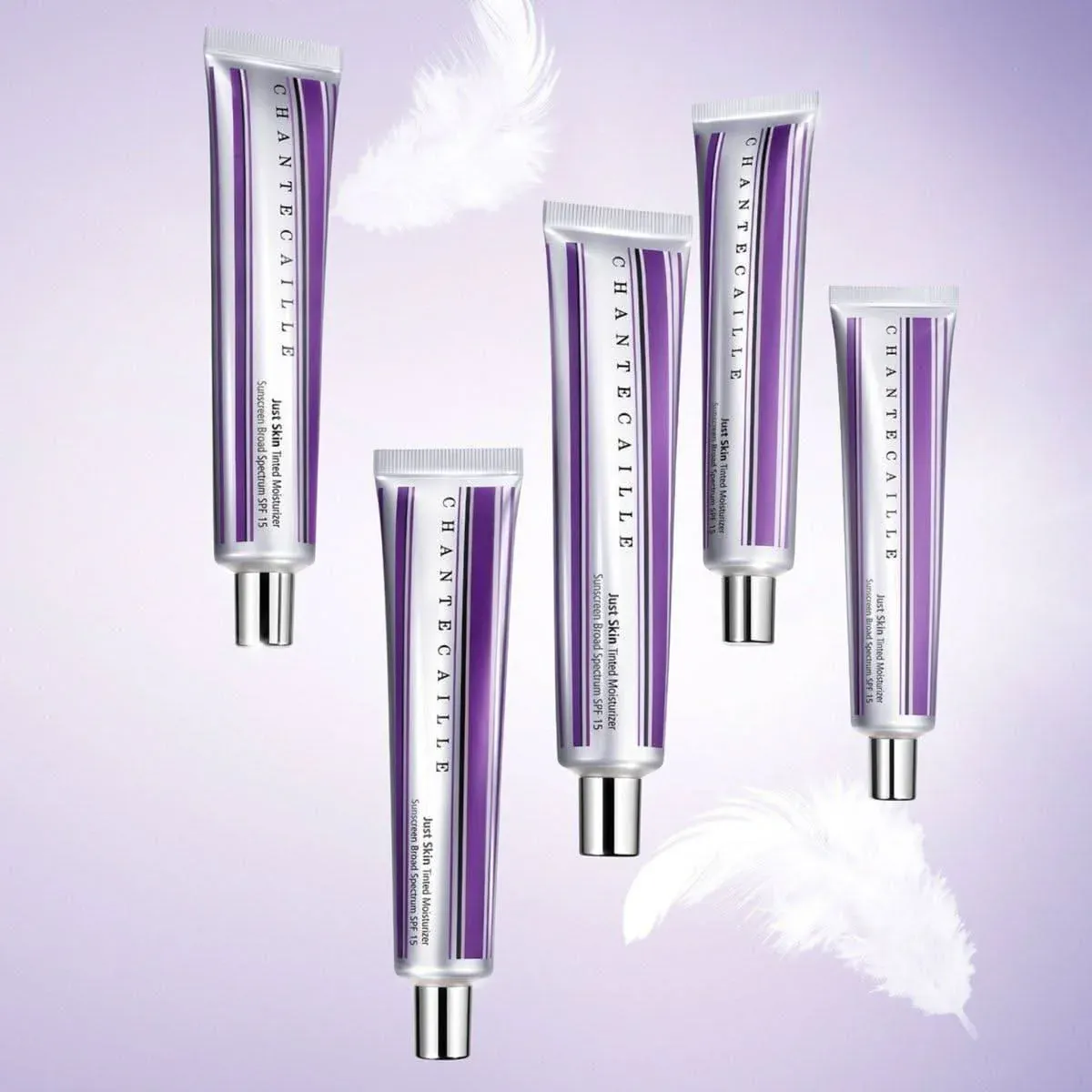Five silver and purple tubes of Chantecaille skin tint