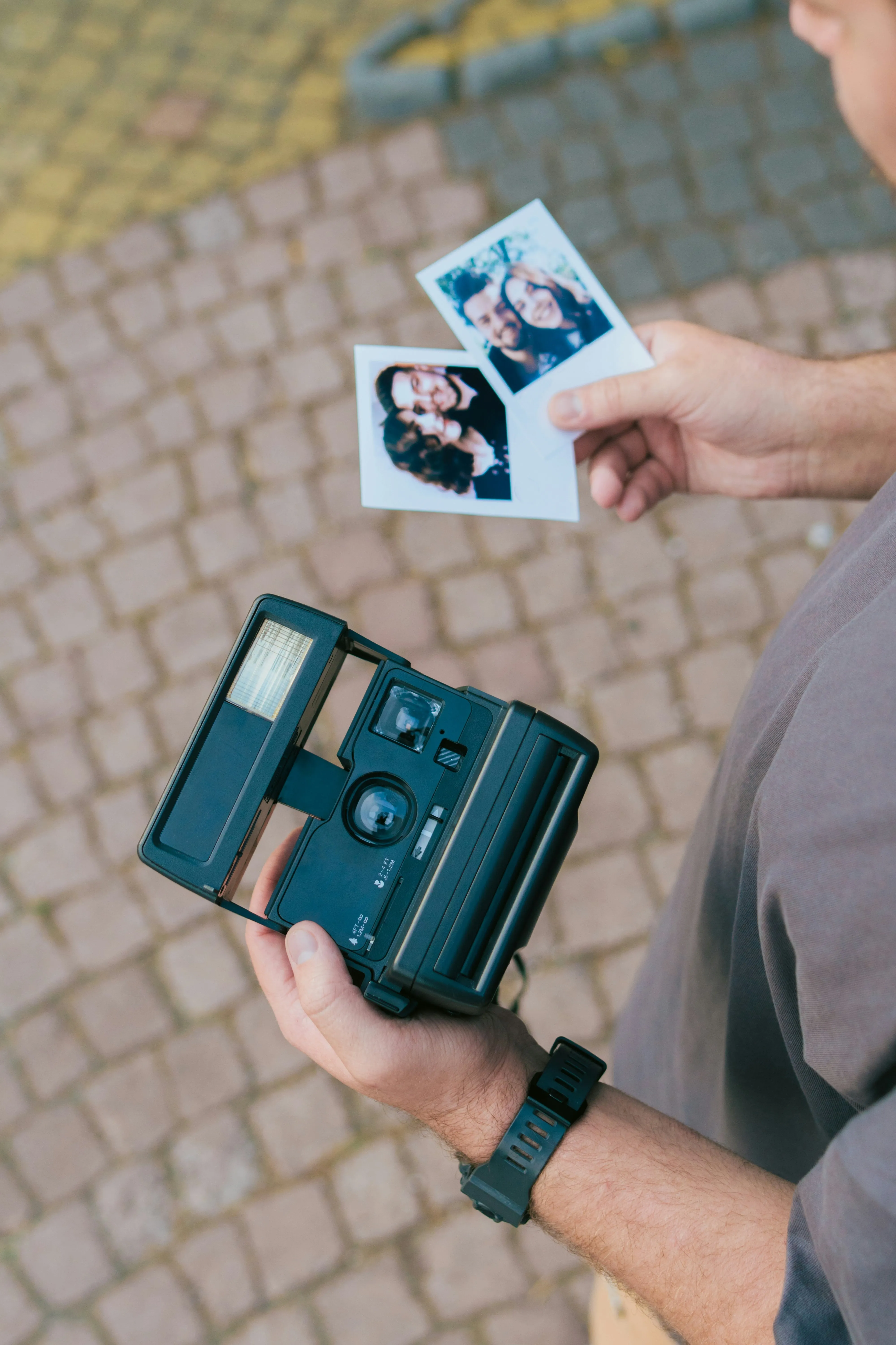 An old-school polaroid camera with photos to show how nostalgia in India is extremely popular, even though its millennial nostalgia and not Gen Z nostalgia, which saw many retro comebacks 2025