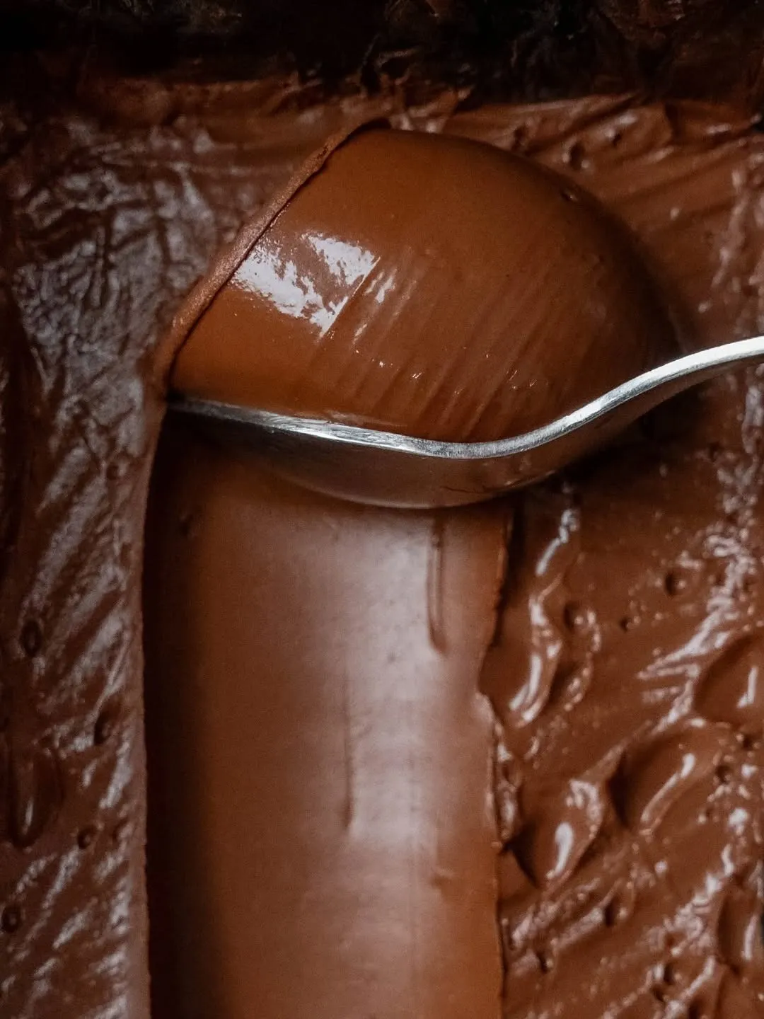 A spoon scooping out chocolate to show how India is making the best dark chocolate India with brands like Pascati chocolate