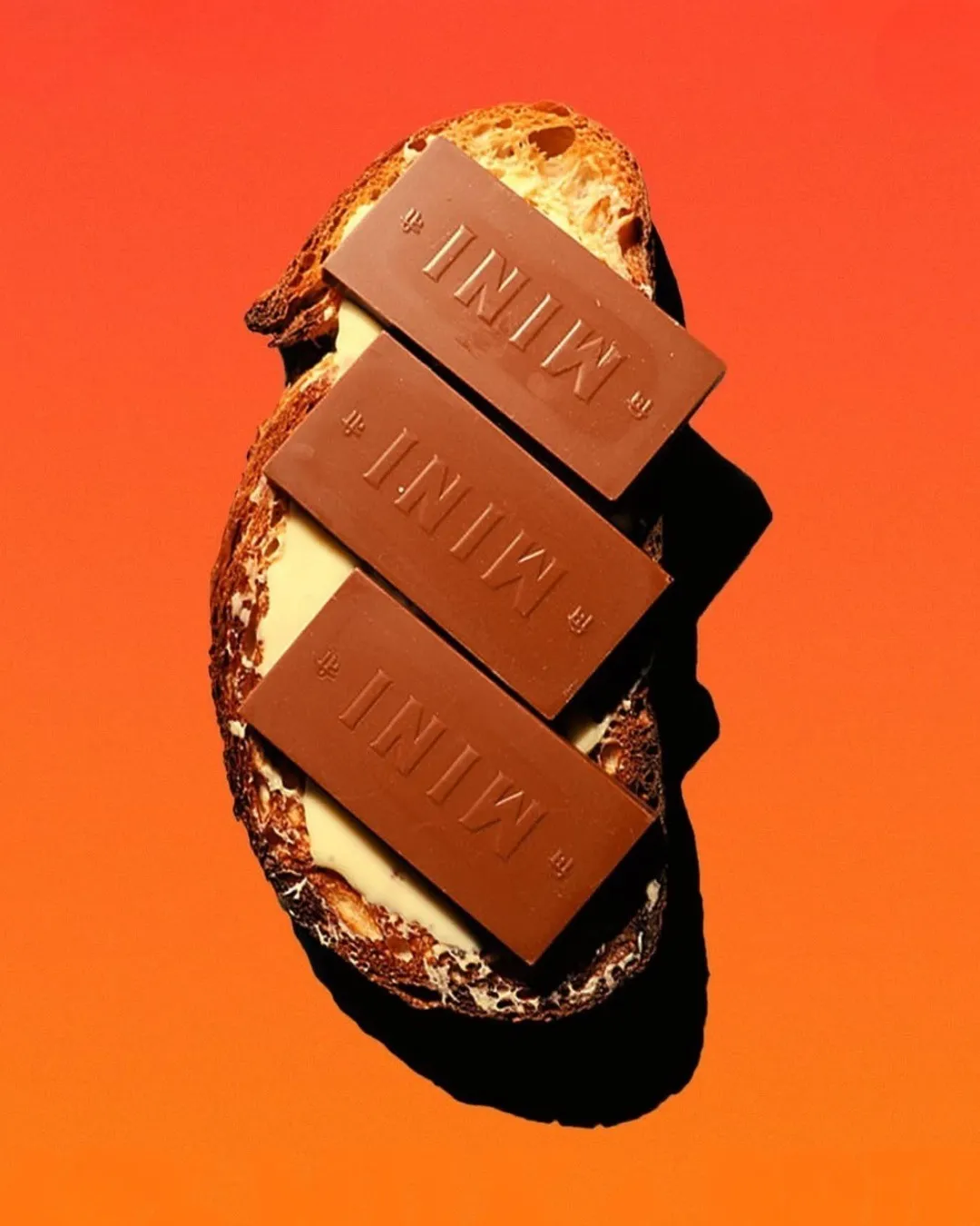 A picture of chocolate bars on a piece of sourdough to show how artisanal chocolate India is taking over as coffee and cafes offer authentic bean-to-bar chocolate India