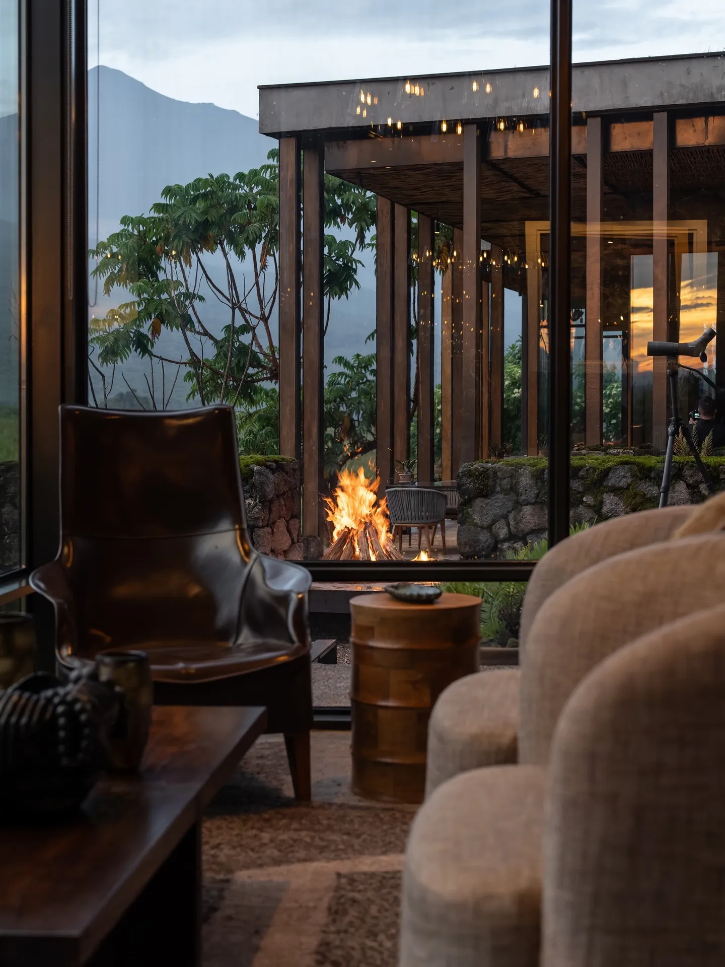 Interior view of a safari lodge designed to blend into its natural surroundings, reflecting responsible luxury tourism through sustainable architecture and restrained scale