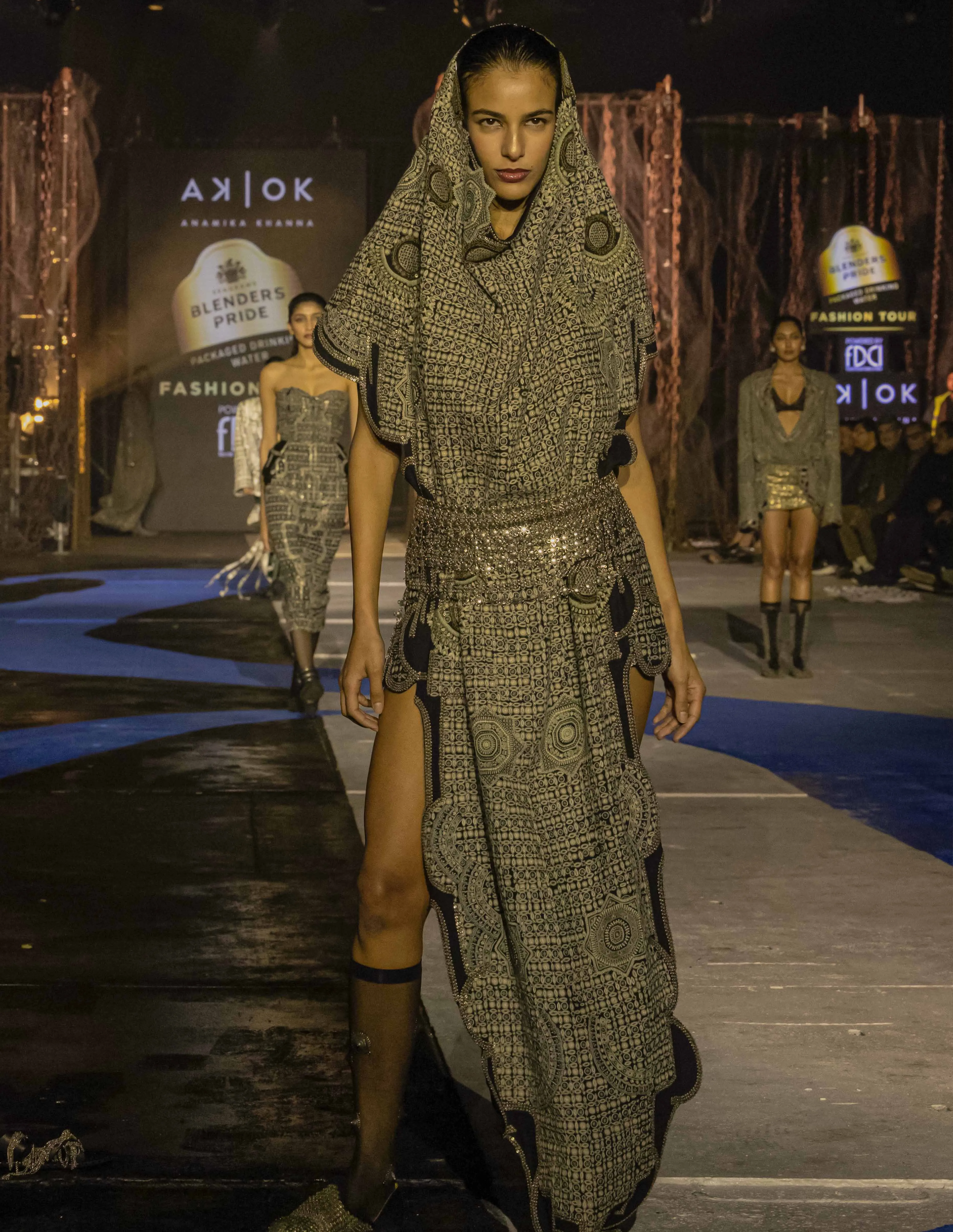 A picture of a model in a dress by Anamika Khanna at the Blenders Pride Fashion Tour 2025