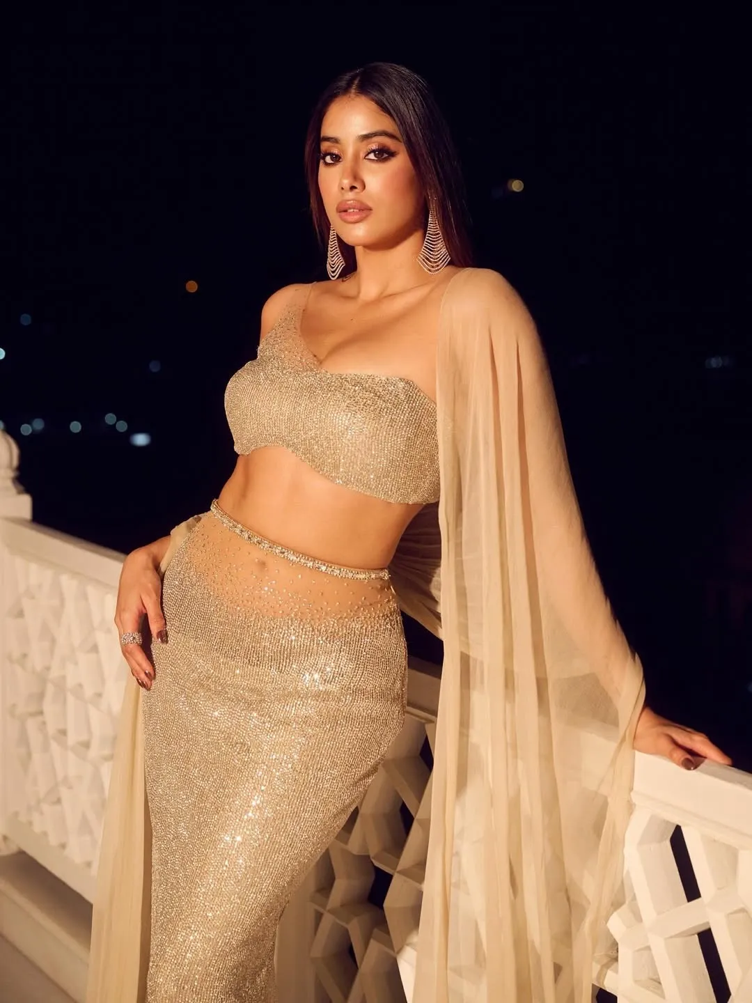 A picture of Janhvi Kapoor in a golden metallic dress