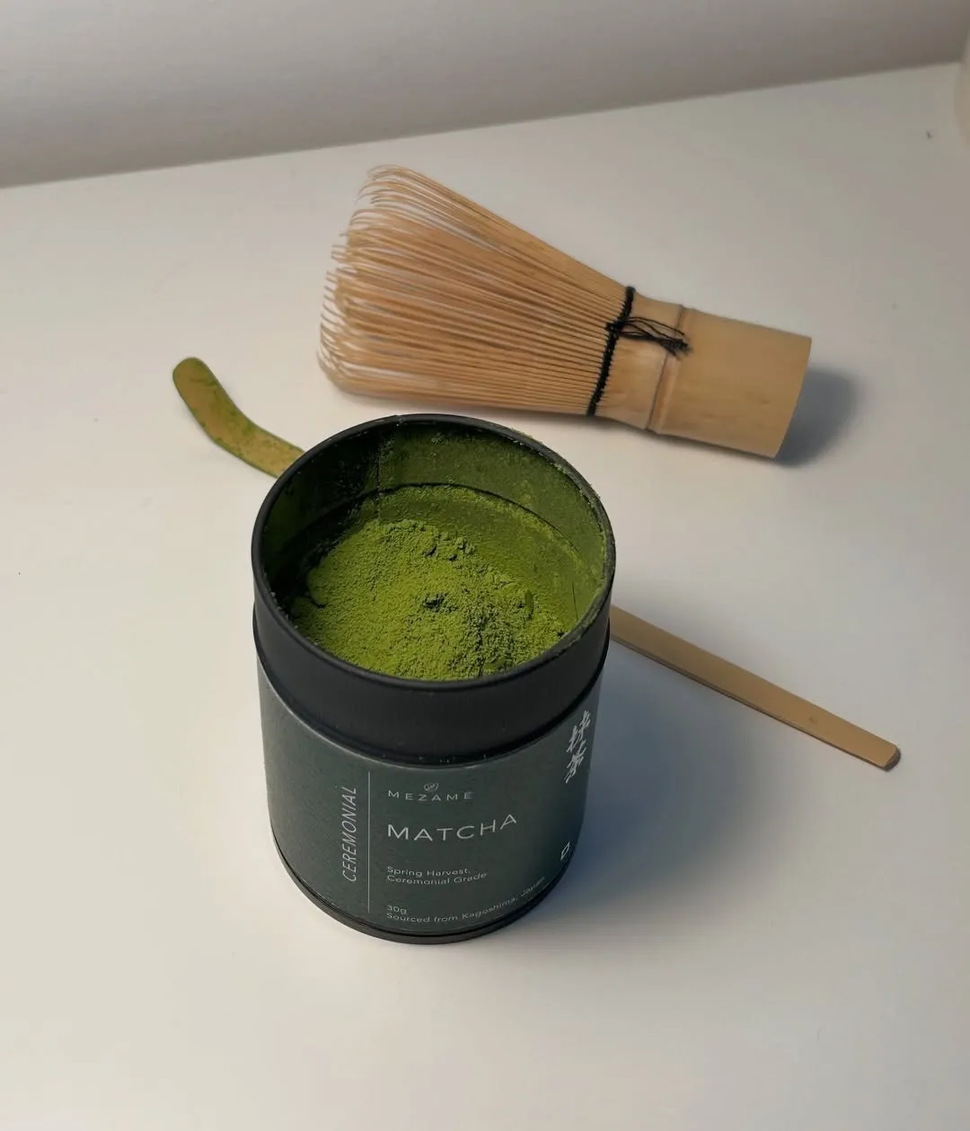 Mezame matcha in a tin with a whisk