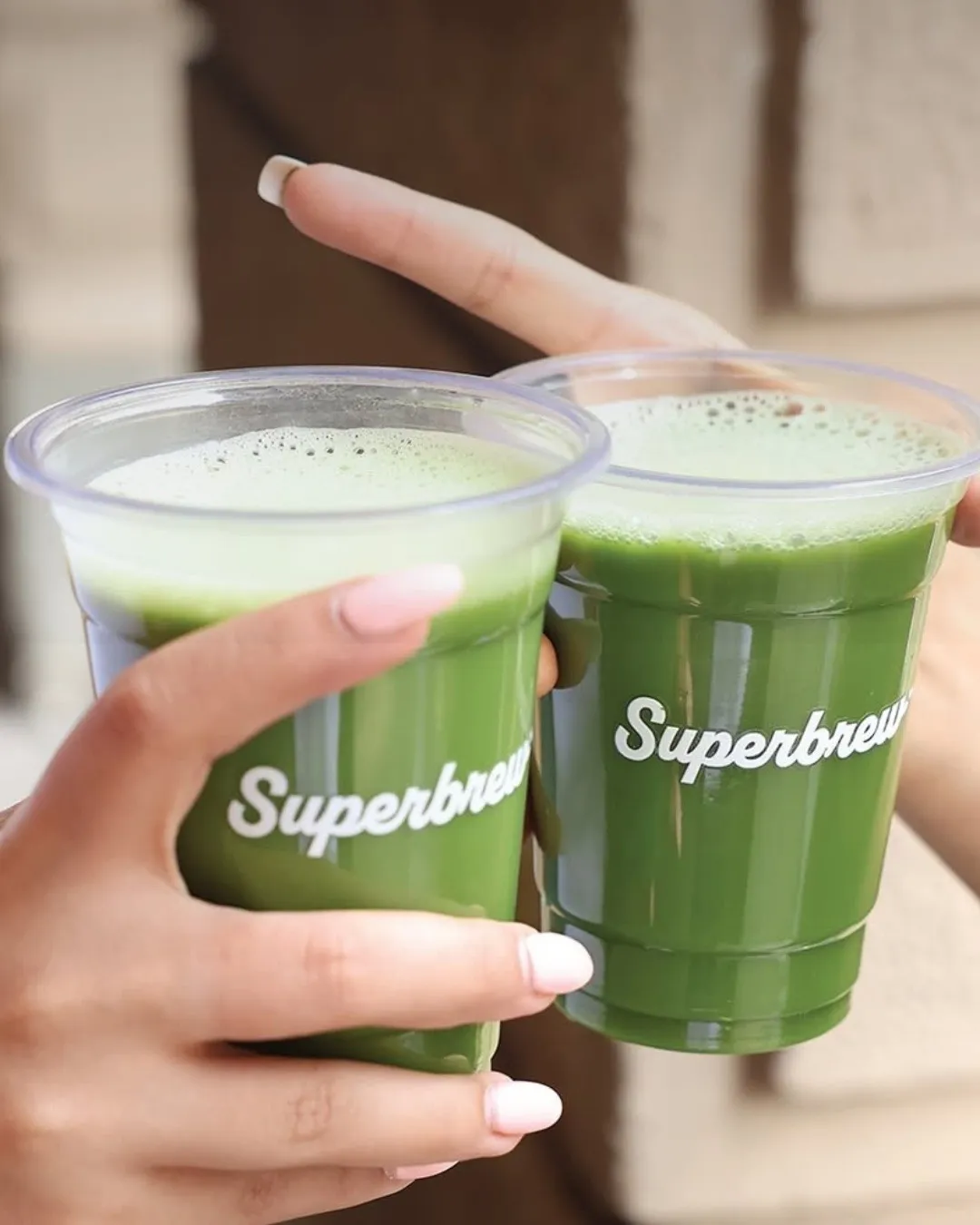 Two glasses of Superbrew iced matcha latte