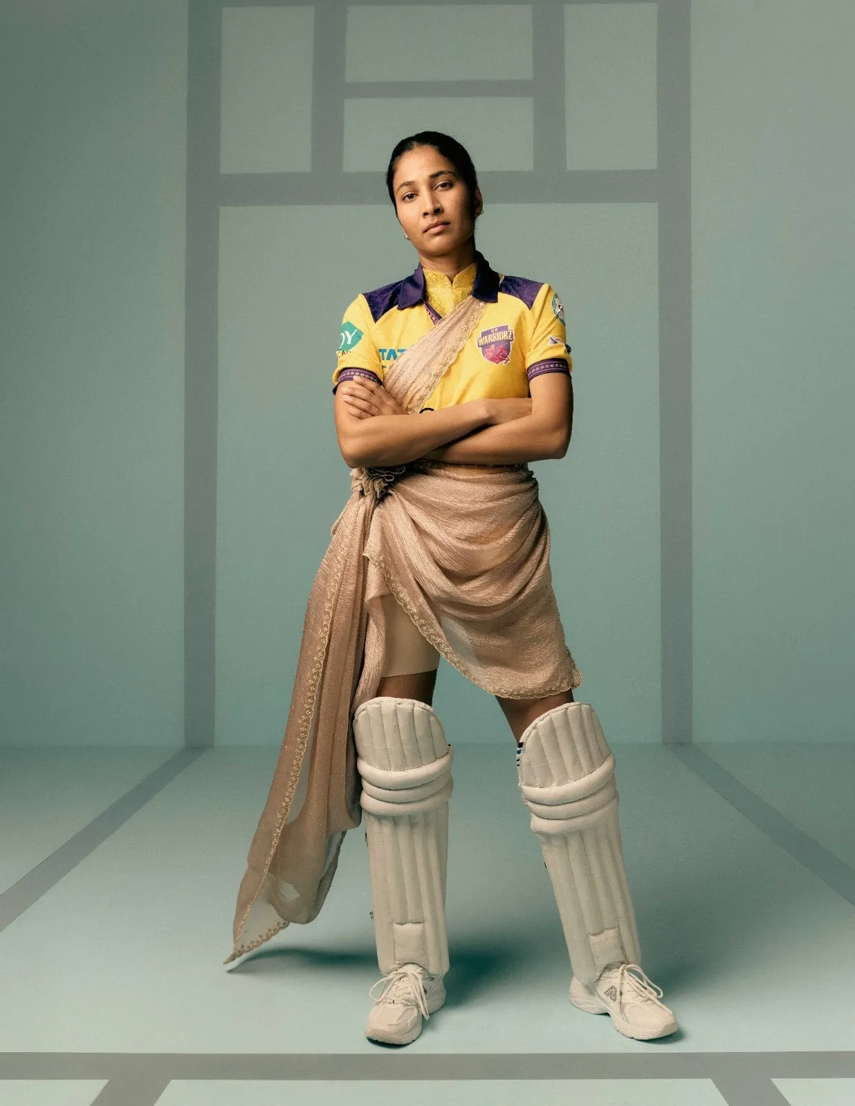 UP Warriorz player wearing cricket jersey styled with Banarasi drape, reflecting fashion and uniform in women&rsquo;s cricket