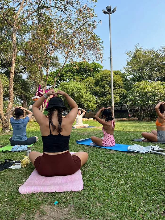 A group of young kids participating in some yoga pose