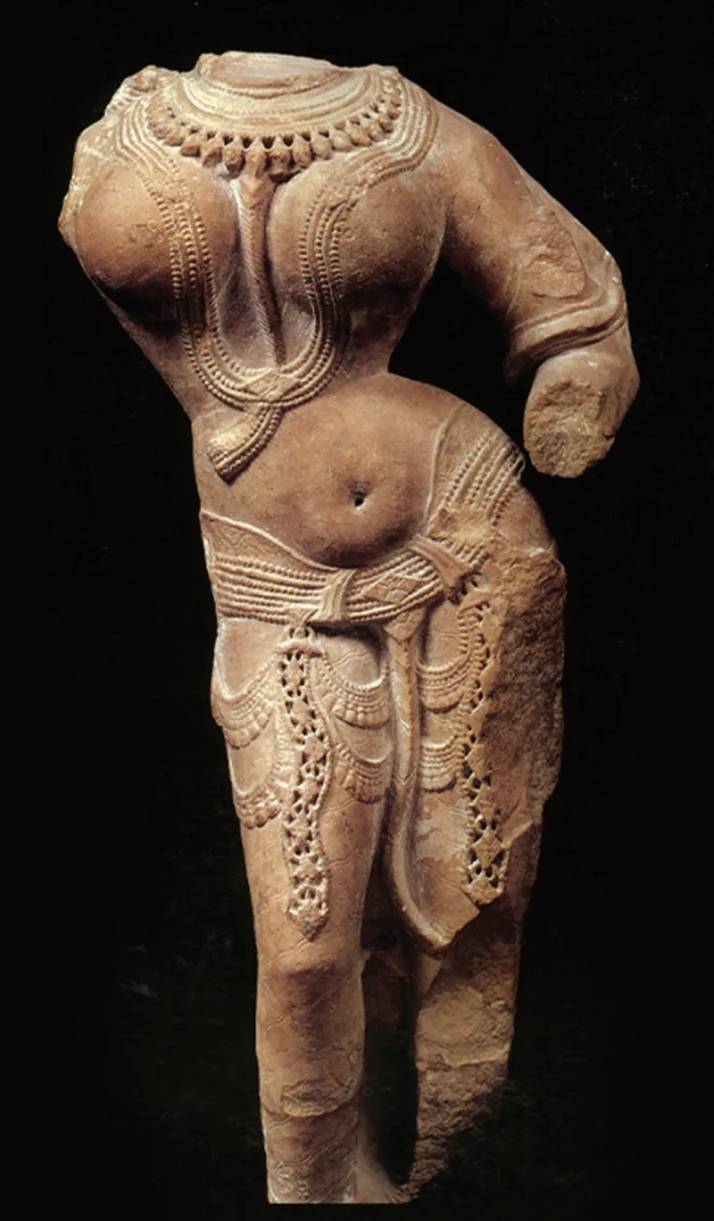 Ancient Indian stone sculpture depicting a female torso with pronounced hips reflecting historical body ideals
