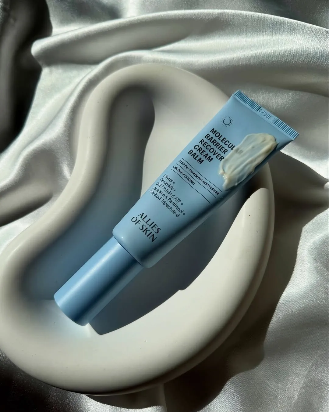 A blue tube of Allies of Skin Molecular Barrier Balm, which is the best colloidal oatmeal cream for barrier repair