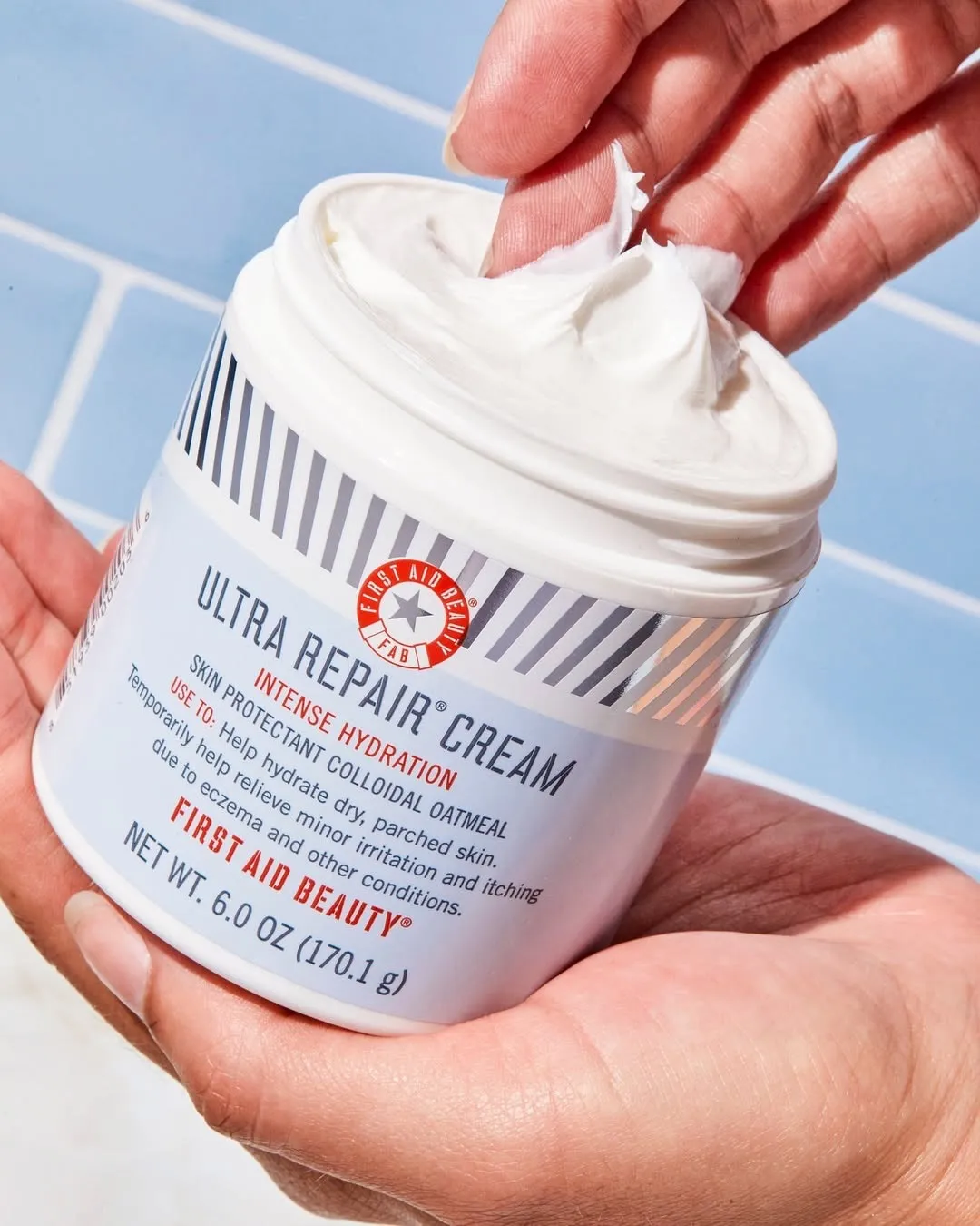 A jar of First Aid Beauty Ultra Repair Cream that nourishes  dry, eczema-prone skin