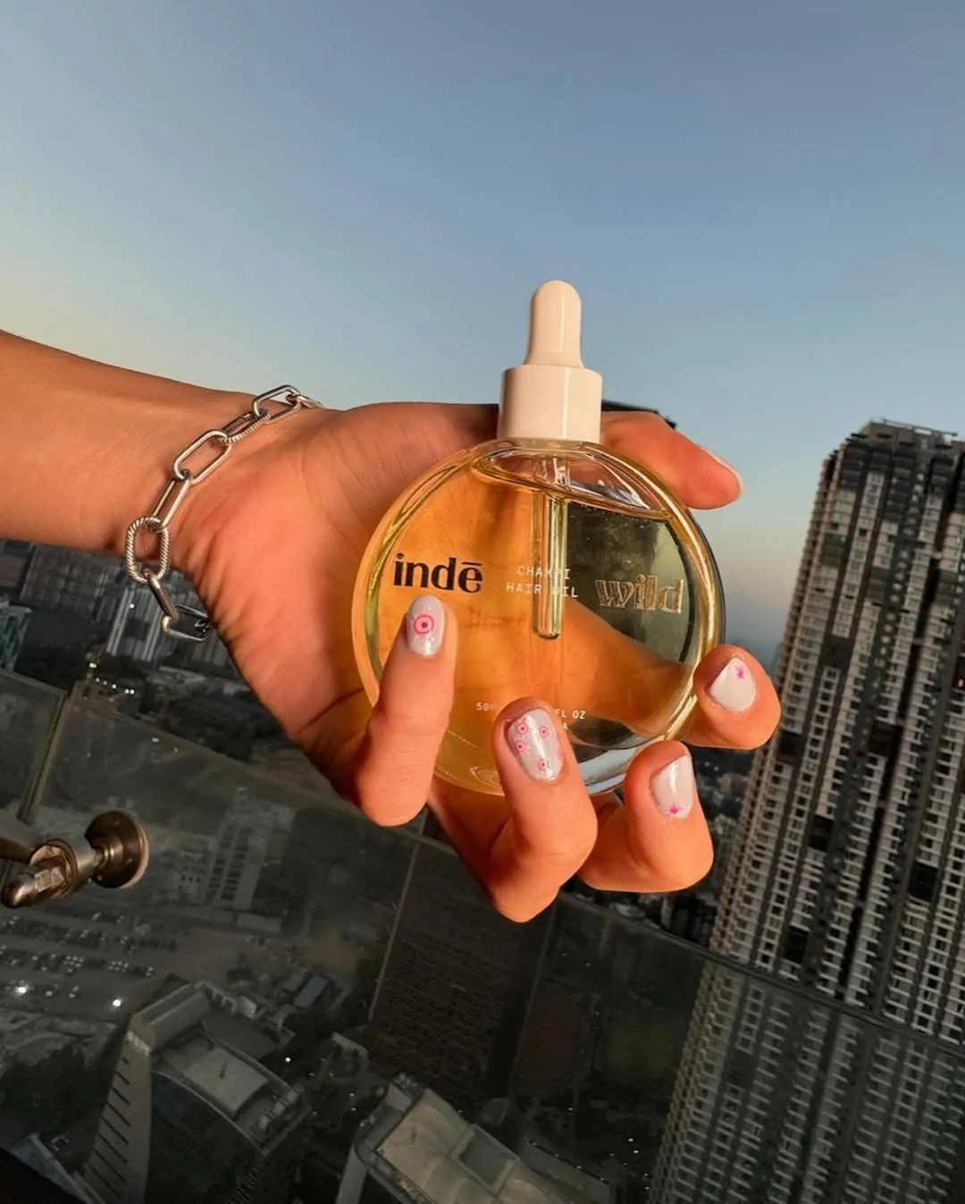 A bottle of inde wild, the best hair oil for champi