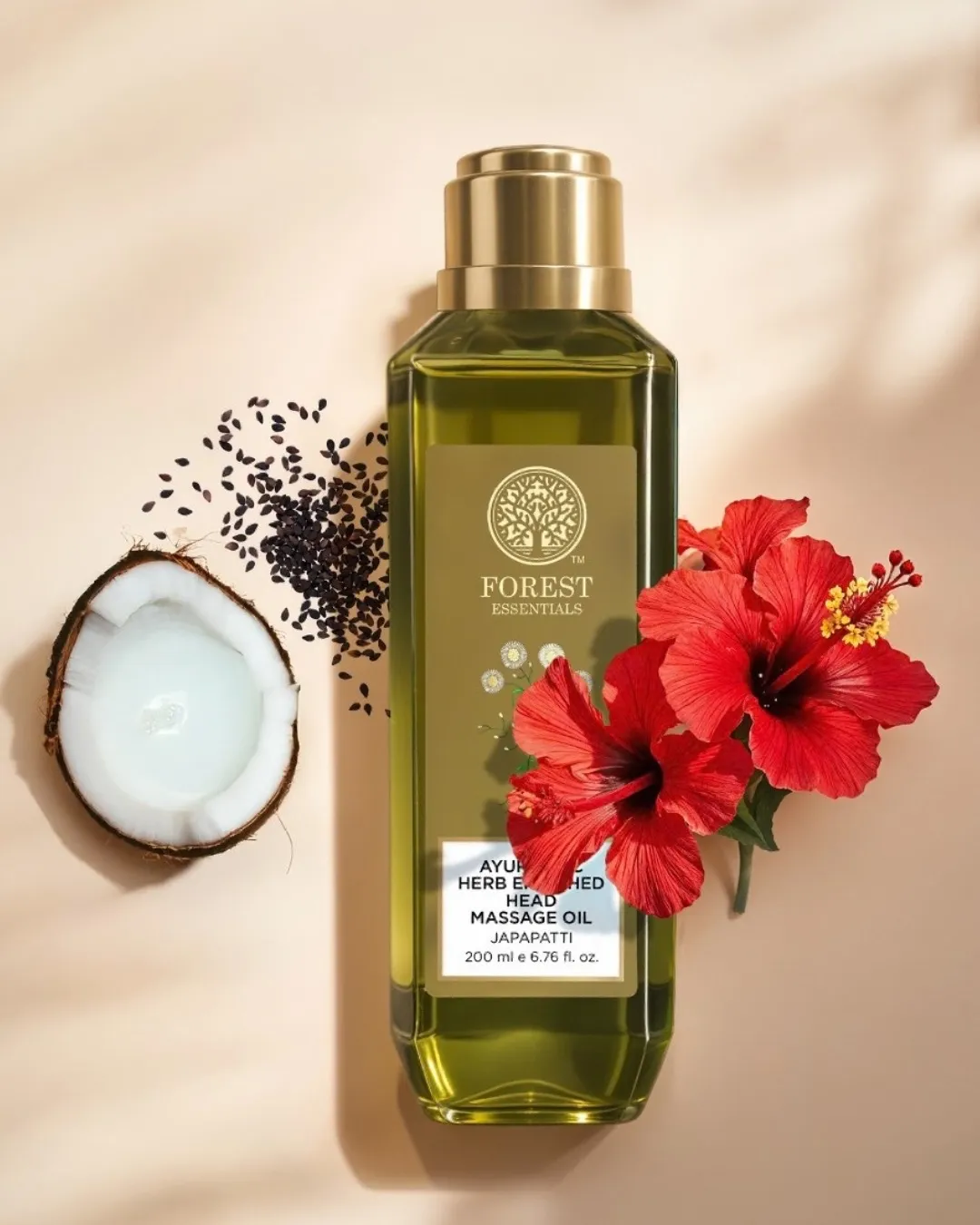 A bottle of hair oil with ingredients kept on the side