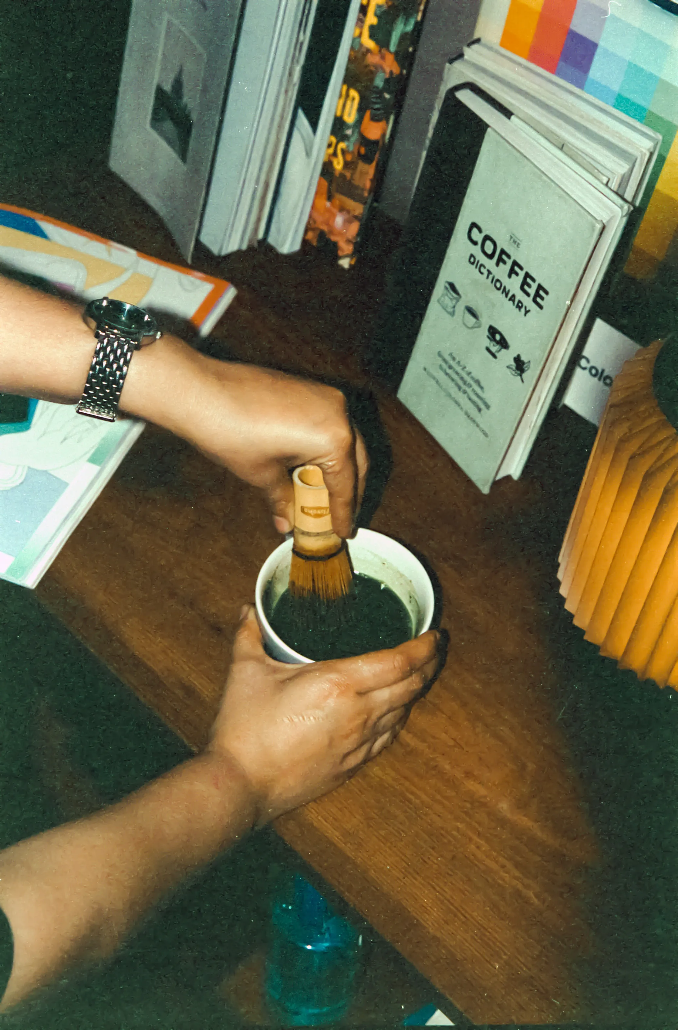 A person making coffee at Genre, which caters to cafe culture in India during the day and turns into a bar that caters to nightlife culture India besides working as one of the popular urban social spaces India via its vinyl listening sessions