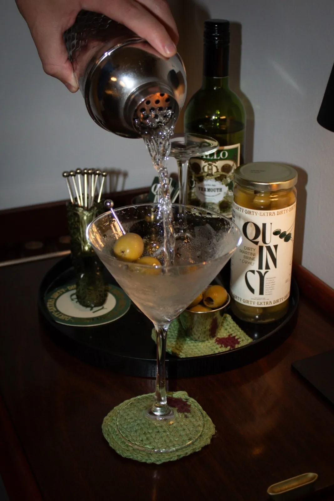 A picture of a drink being made to show the rising popularity of home bar essentials, home bar setup, bar tools for home, essential liquors for home bar and essential glasses for home bar