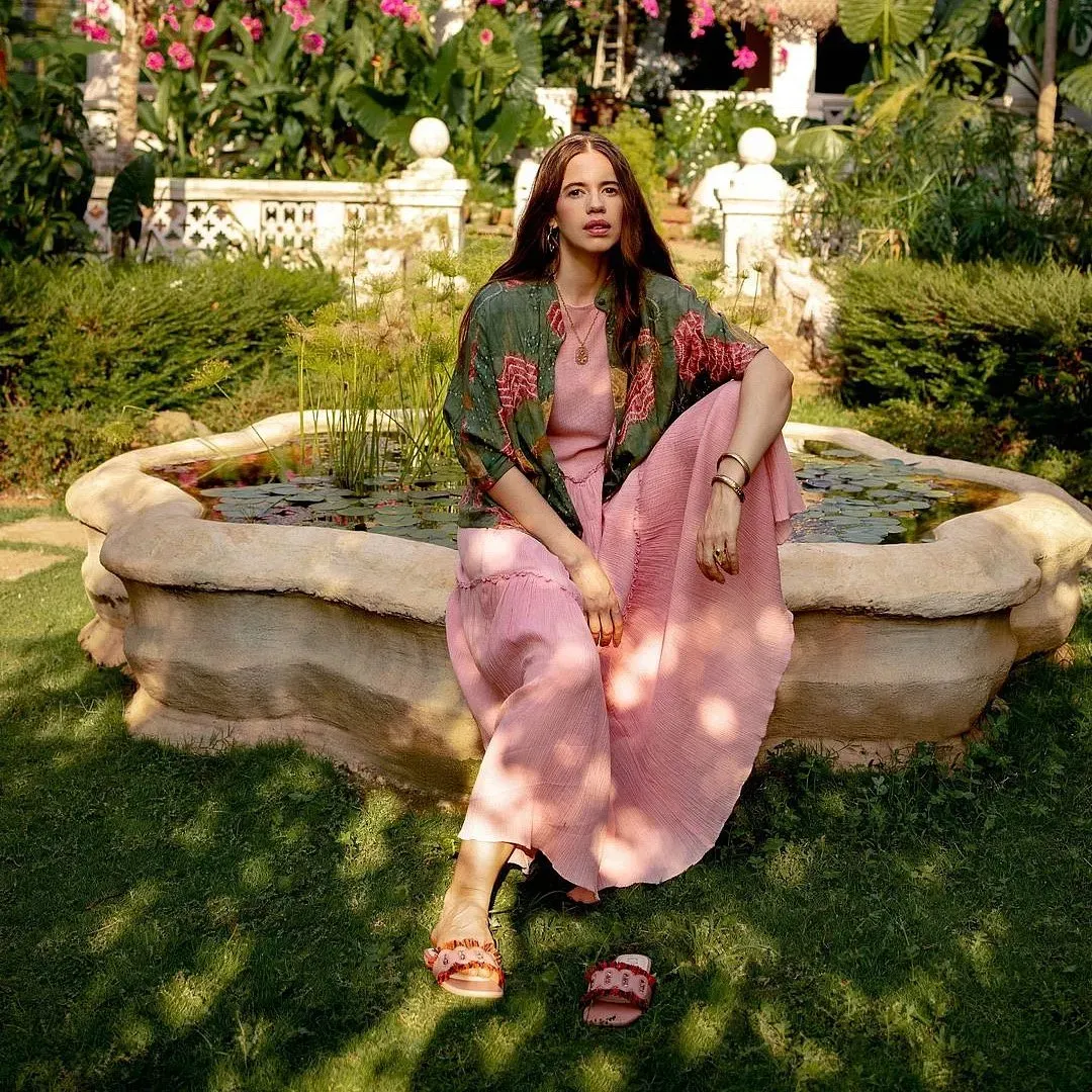 Model wearing 11.11 sustainable fashion label in handloom cotton dress and natural dye jacket