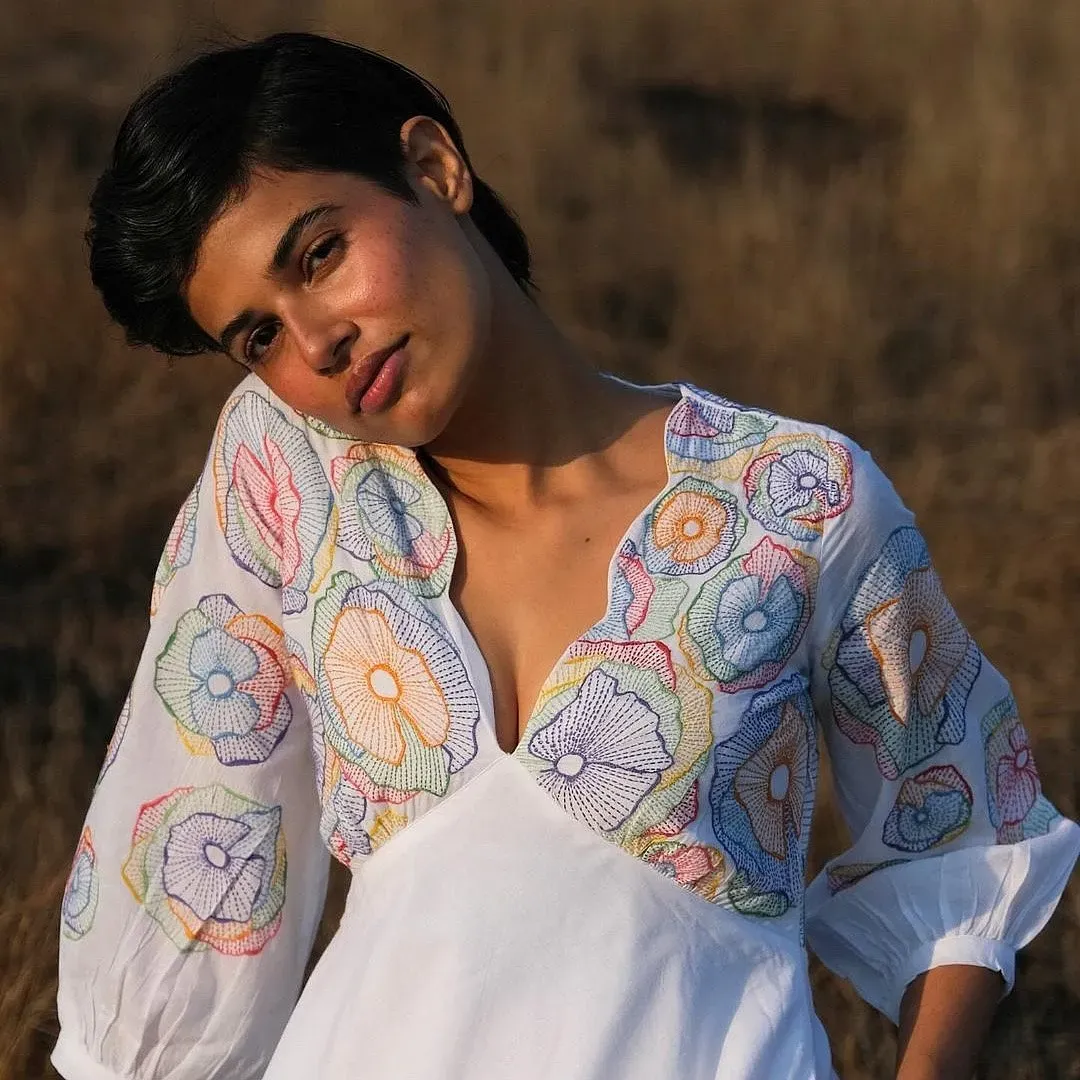 Model wearing Okhai embroidered cotton dress with Rabari craft detailing