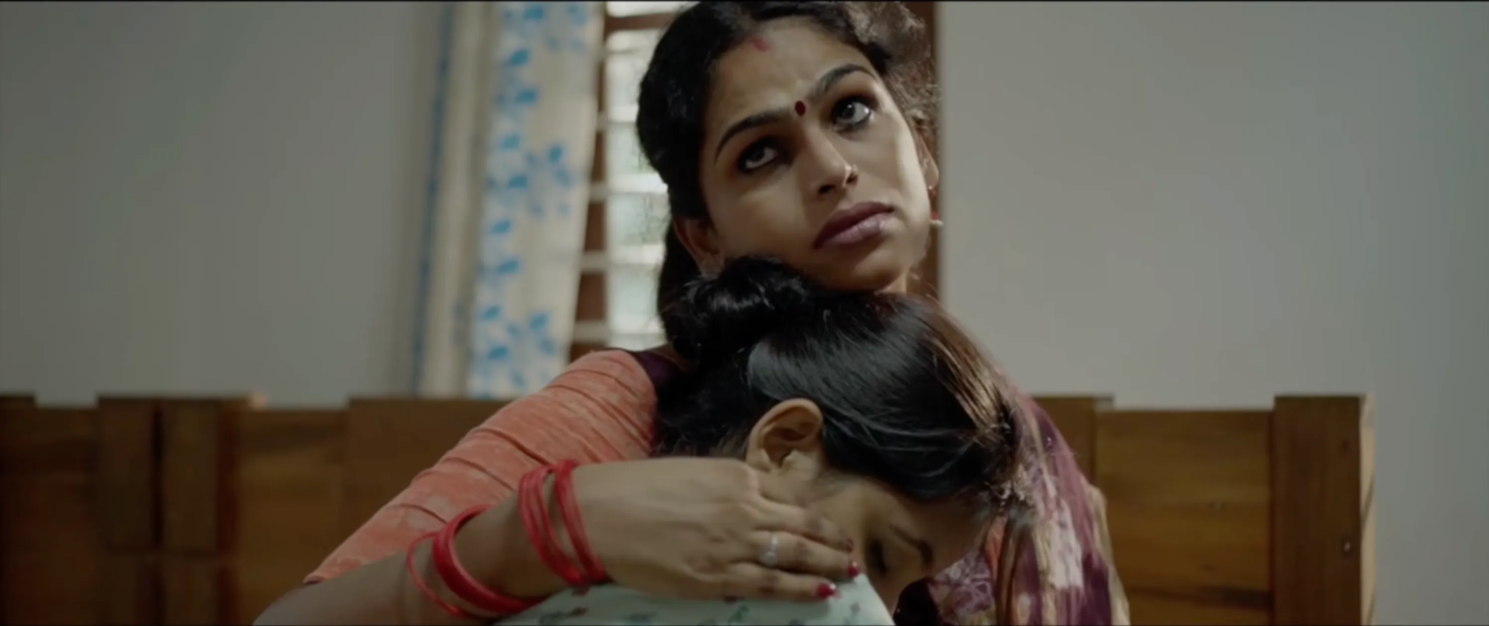 A still from Negha Shahin's Antharam showing two women consoling each other to show how queer filmmakers in India, LGBTQ filmmakers India, trans filmmakers India, queer screenwriting lab, queer producers India, and queer film festivals India, are increasing queer representation in Indian cinema