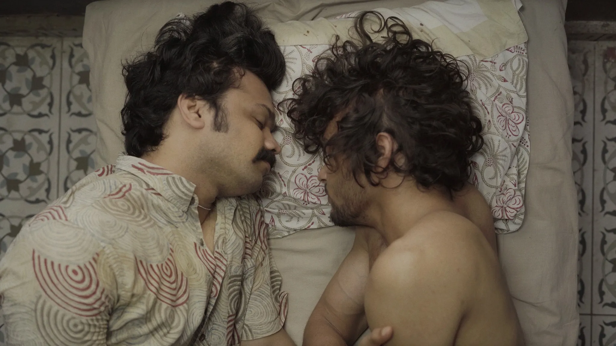 A still from Afrad V K's Riptide with two men lying down in bed queer filmmakers in India to show how LGBTQ filmmakers India, trans filmmakers India, queer screenwriting lab and queer producers India, are making queer cinema India more common