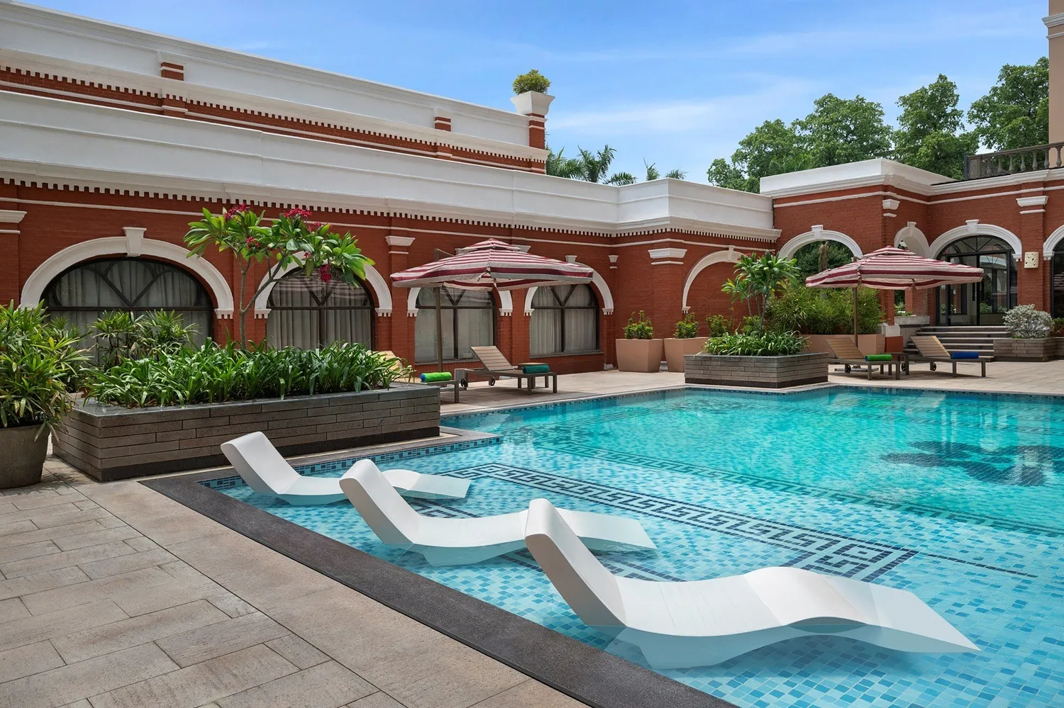 Relax by the pool at Welcomhotel Prayagraj