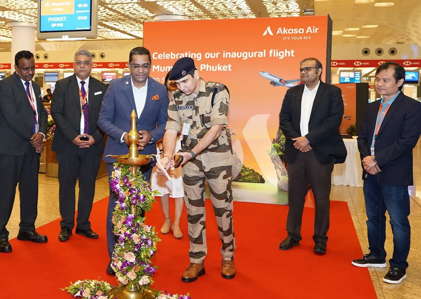 Belson Coutinho, Co-Founder and Chief Operating Officer, Akasa Air and Naarayan TV, Chief Marketing Officer, Akasa Air along with Akasa Air team light the ceremonial lamp to mark Akasa Air’s inaugural flight from