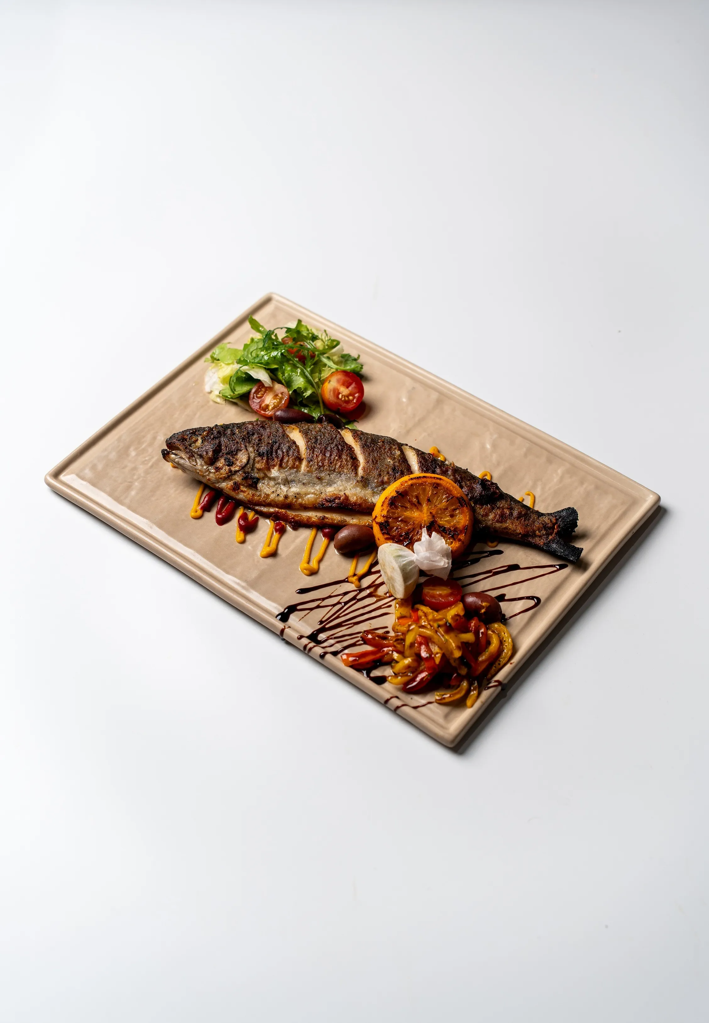 Baked Himalayan Trout Roasted peppers, Spicy orange, Kalamata & Balsamic glaze
