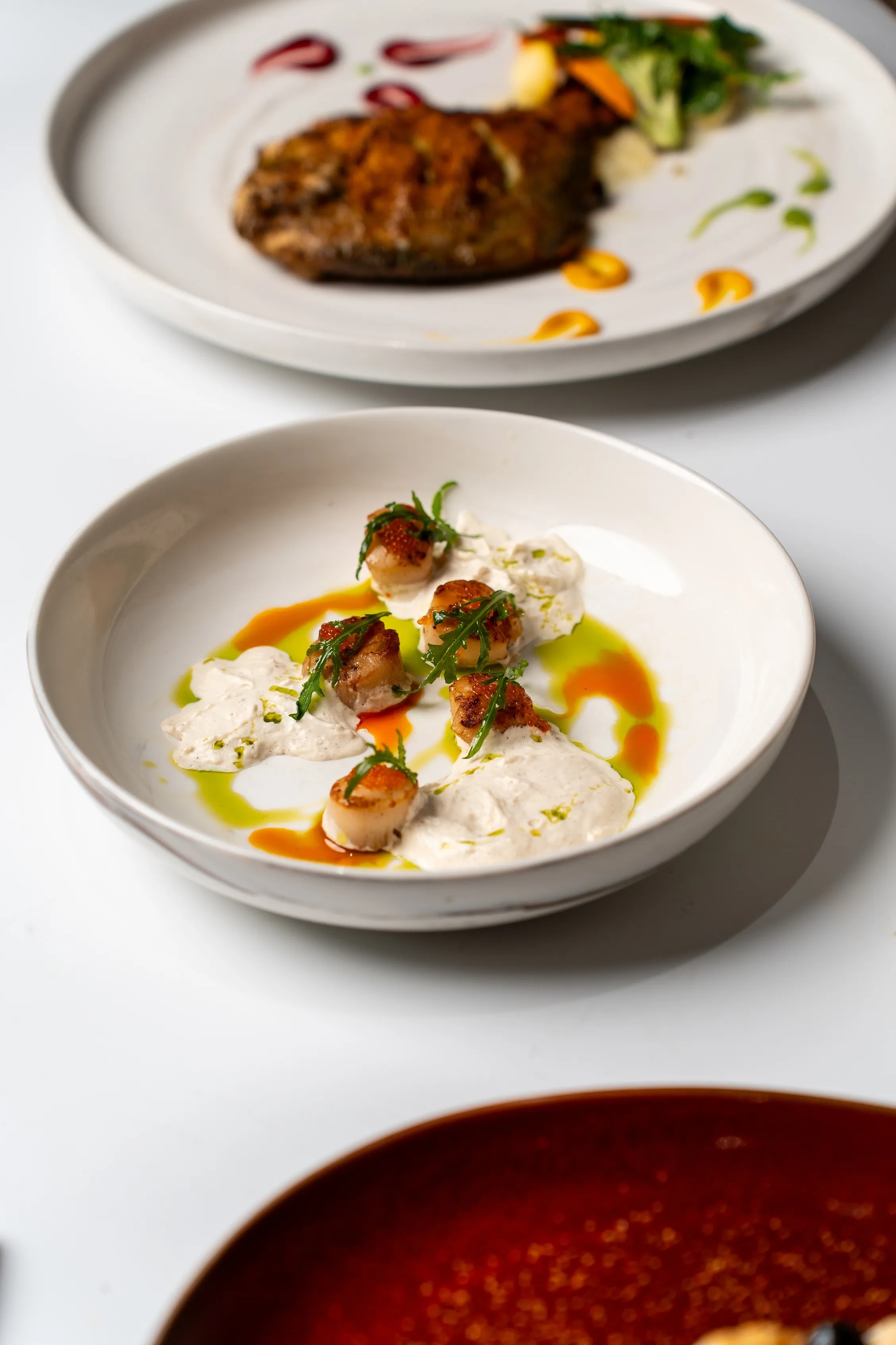 Seared Scallop, Salmon roe, Garlic espuma & Basil oil