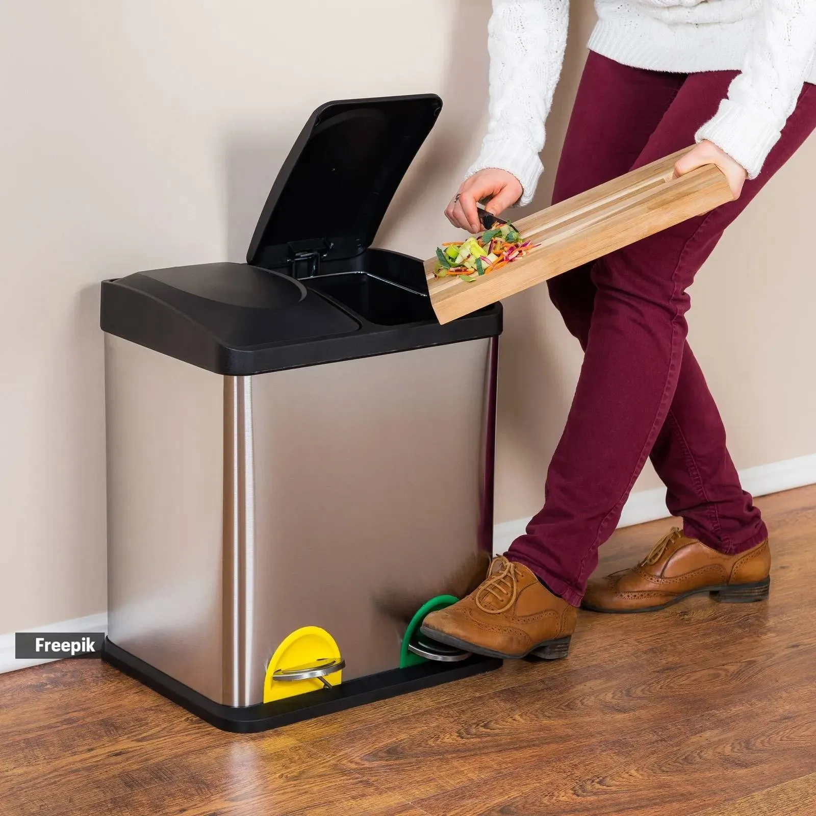 woman throwing wasted food into steel bin