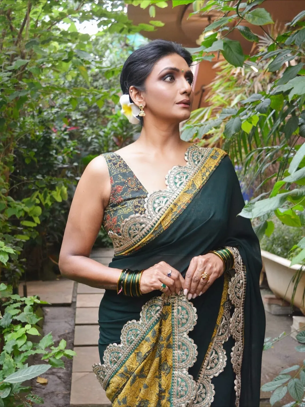 Is it her mystery that draws you, or the way she walks through it 💚Saree by @sujatradesigns#Sha