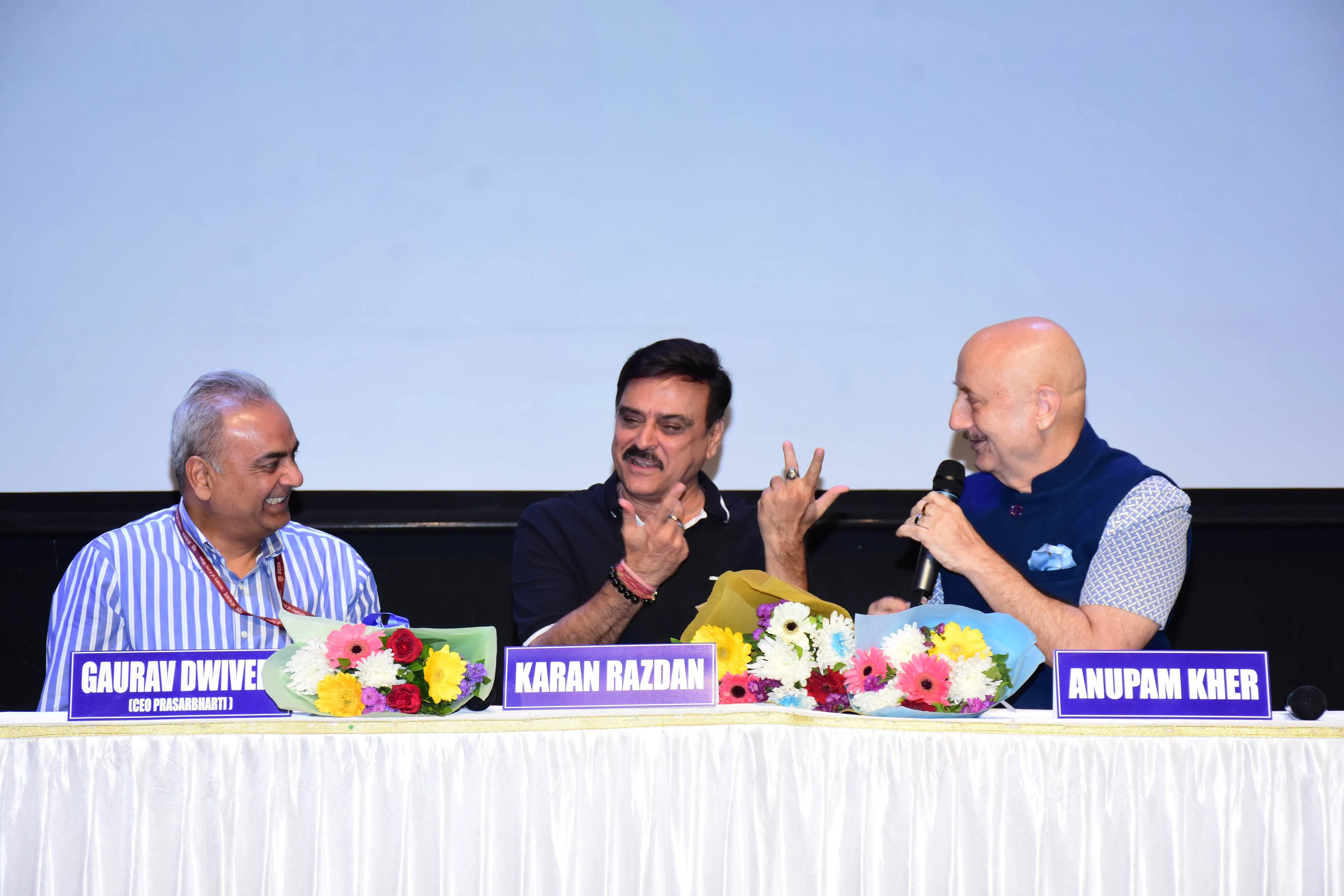 Karan Razdan shares a moment with IAS Gaurav Dwivedi - CEO, Prasar Bharati and Anupam Kher at the Rajni 2.0 press conference
