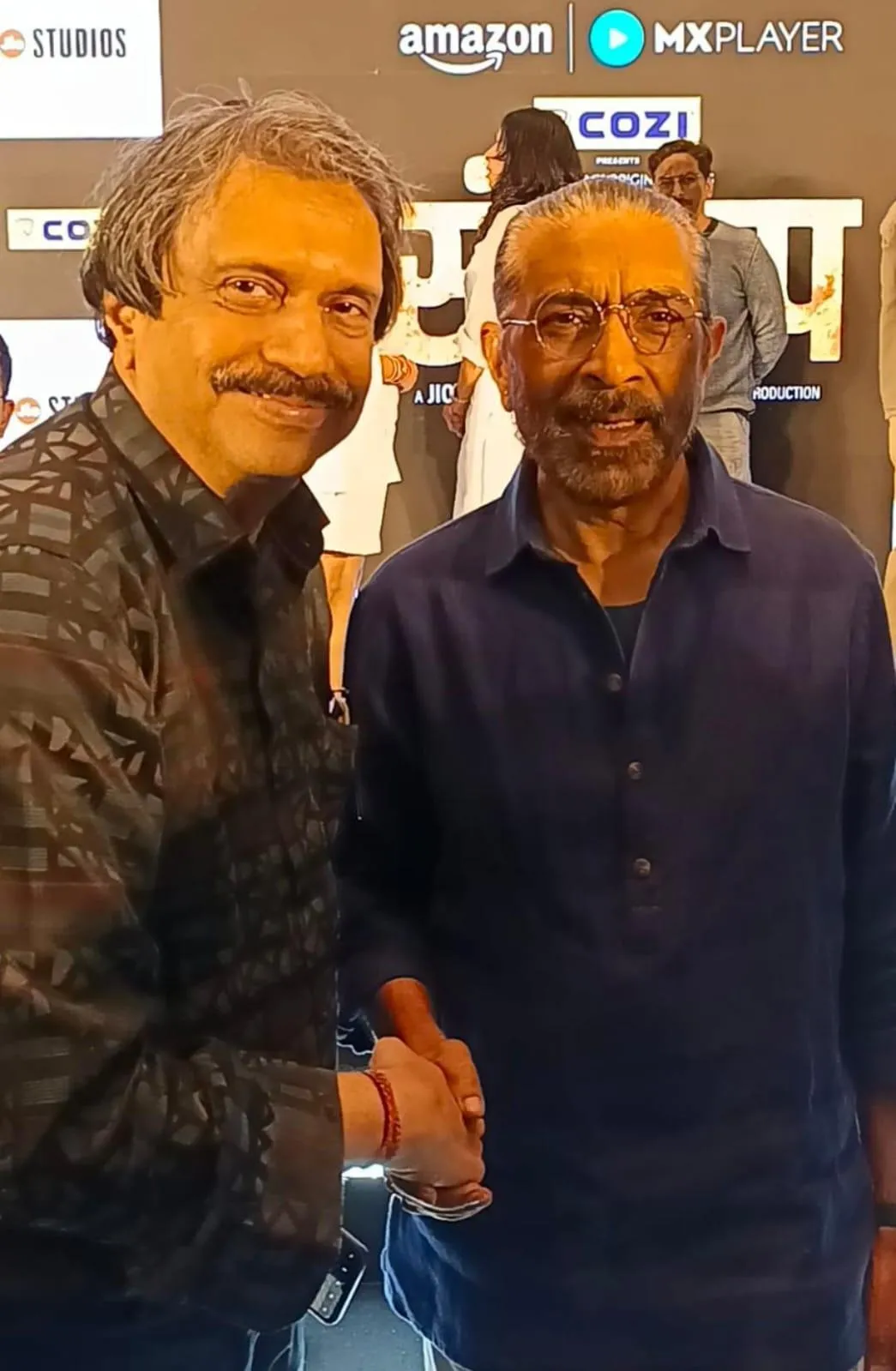 Dir Prakash Jha ( right) warmy greets Sr journalist Chaitanya Padukone