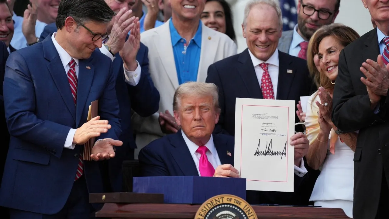 Donald Trump signs ‘Big Beautiful Bill’ at the White House July 4 picnic