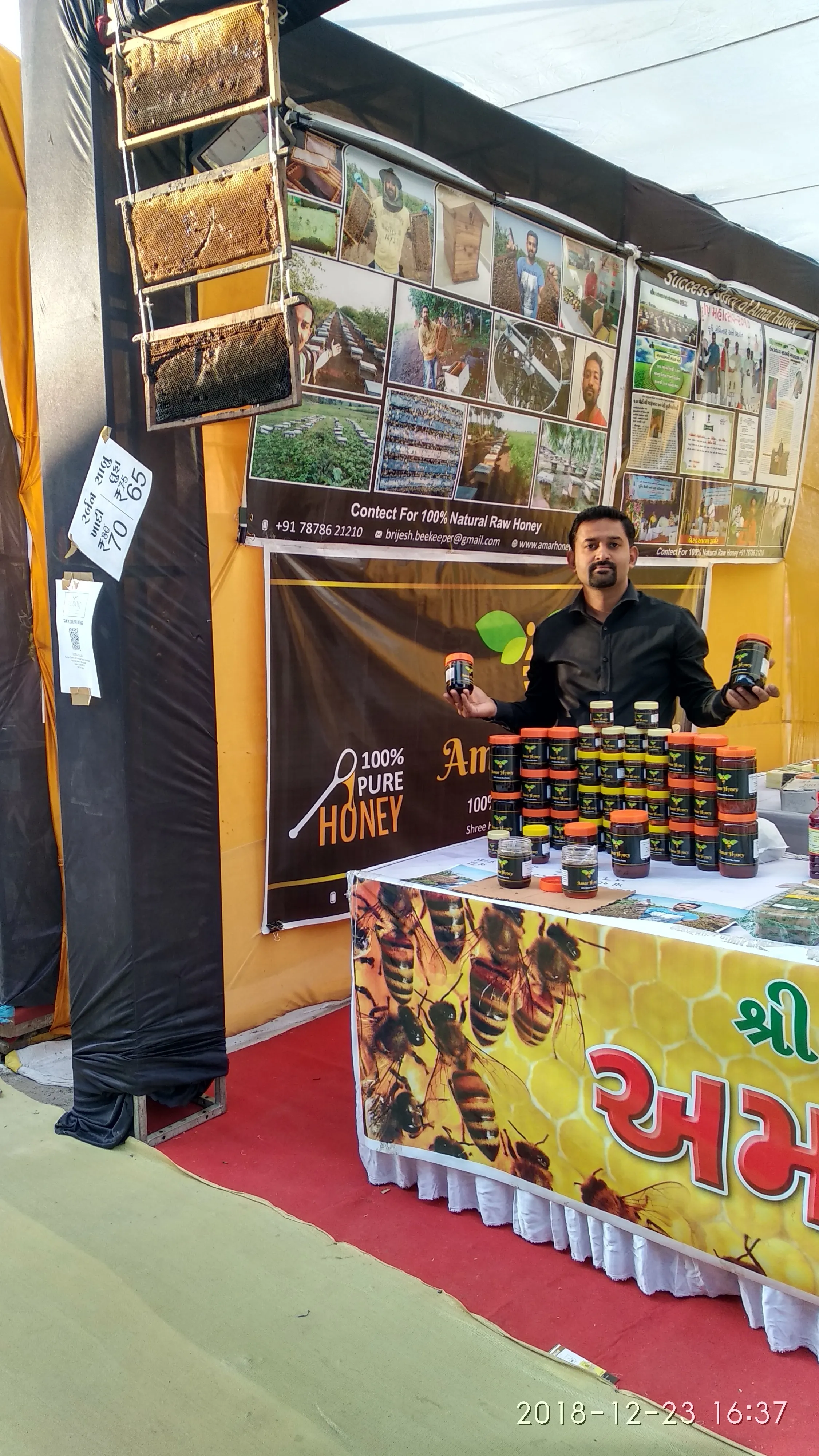Brijesh Kalariya showcasing Amar Honey at an agricultural exhibition