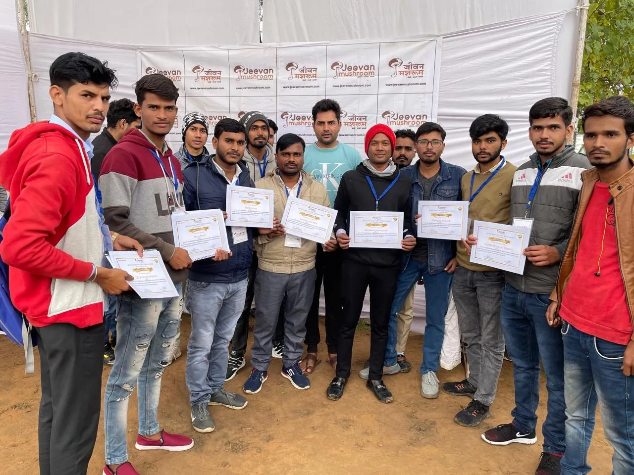 Shanker Meena poses with participants after a successful mushroom cultivation training program at Jeevan Mushroom in Jaipur