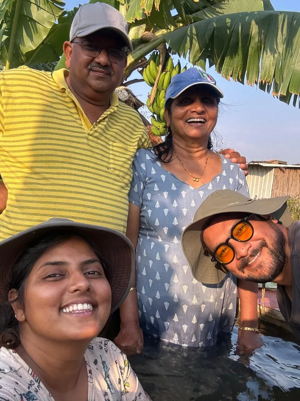 The BaapBeti Permaculture Farm family enjoying a moment together in their field