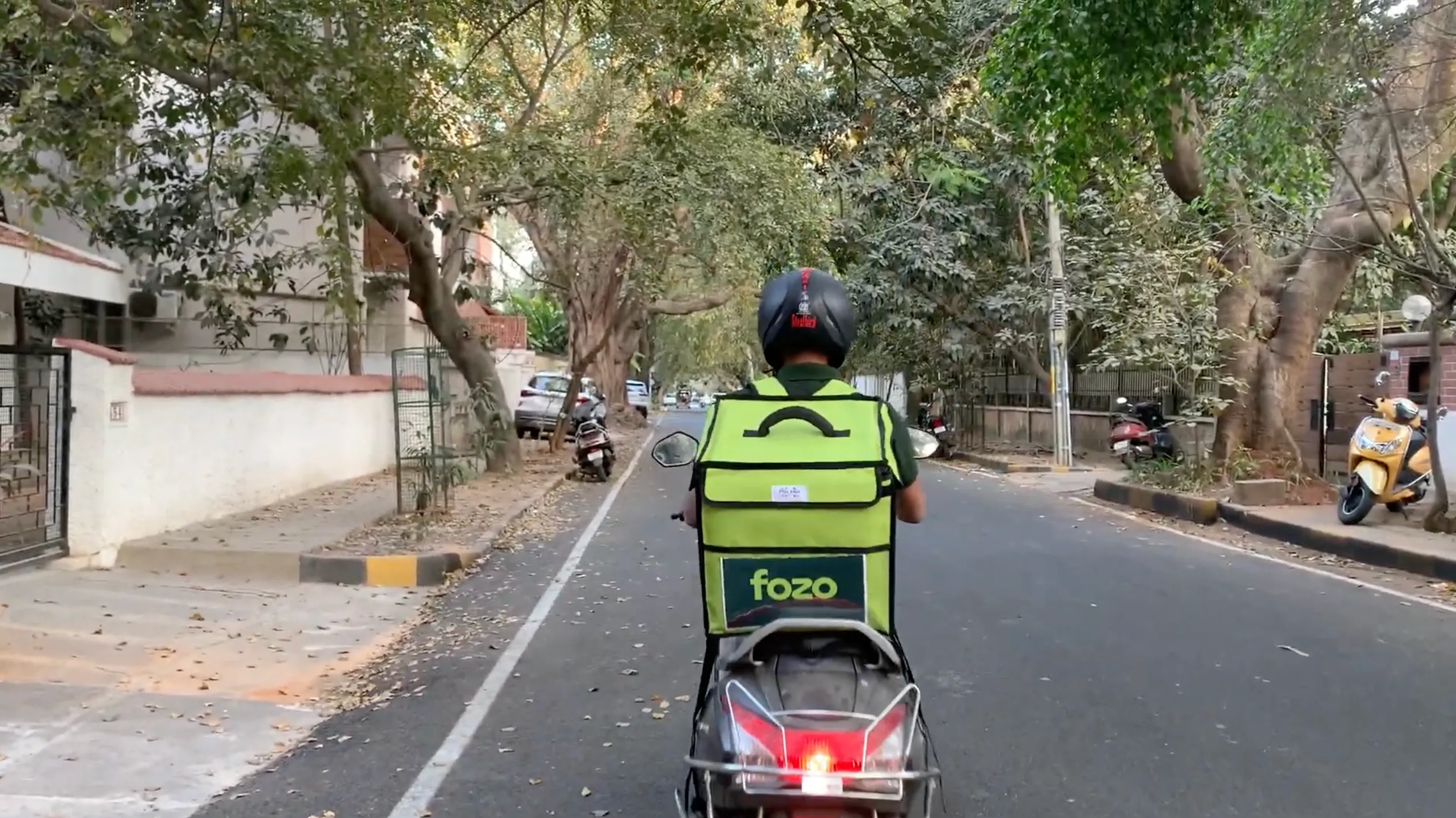 A delivery partner of Fozo on his way to deliver surplus food to customers