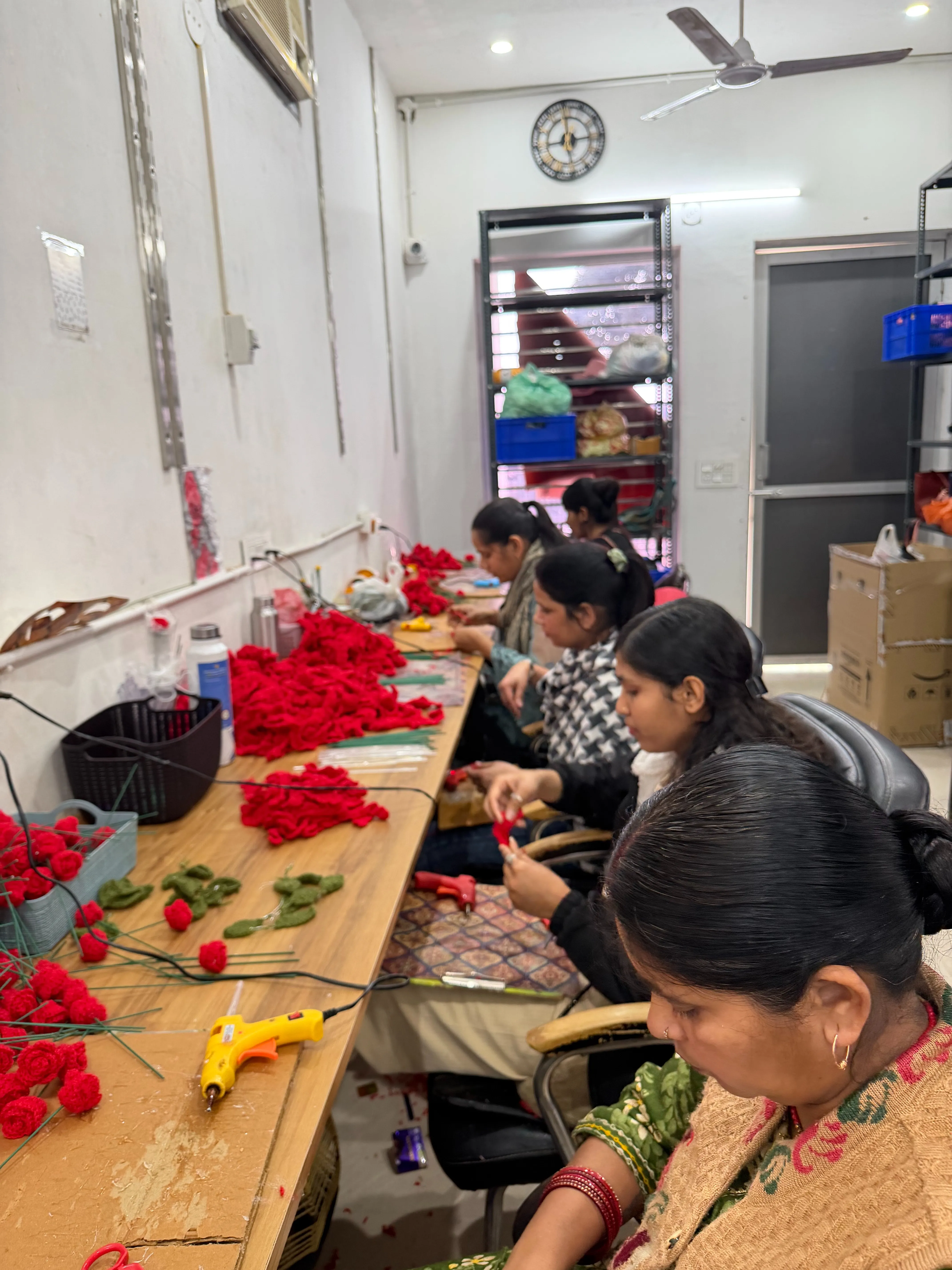 The Floreal team is engaged in crafting crochet products at the warehouse